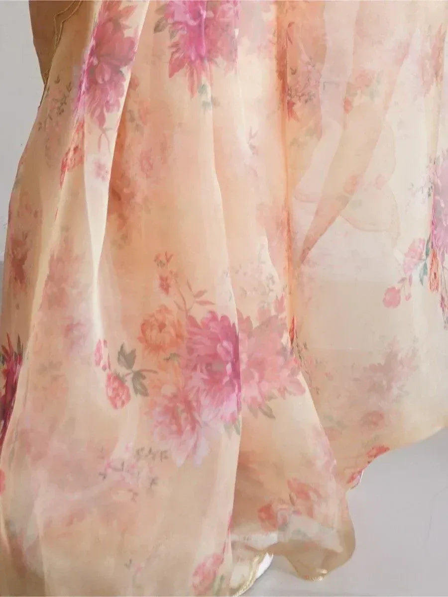Floral printed ethnic gown in soft peach with pink roses, perfect for Indian occasions