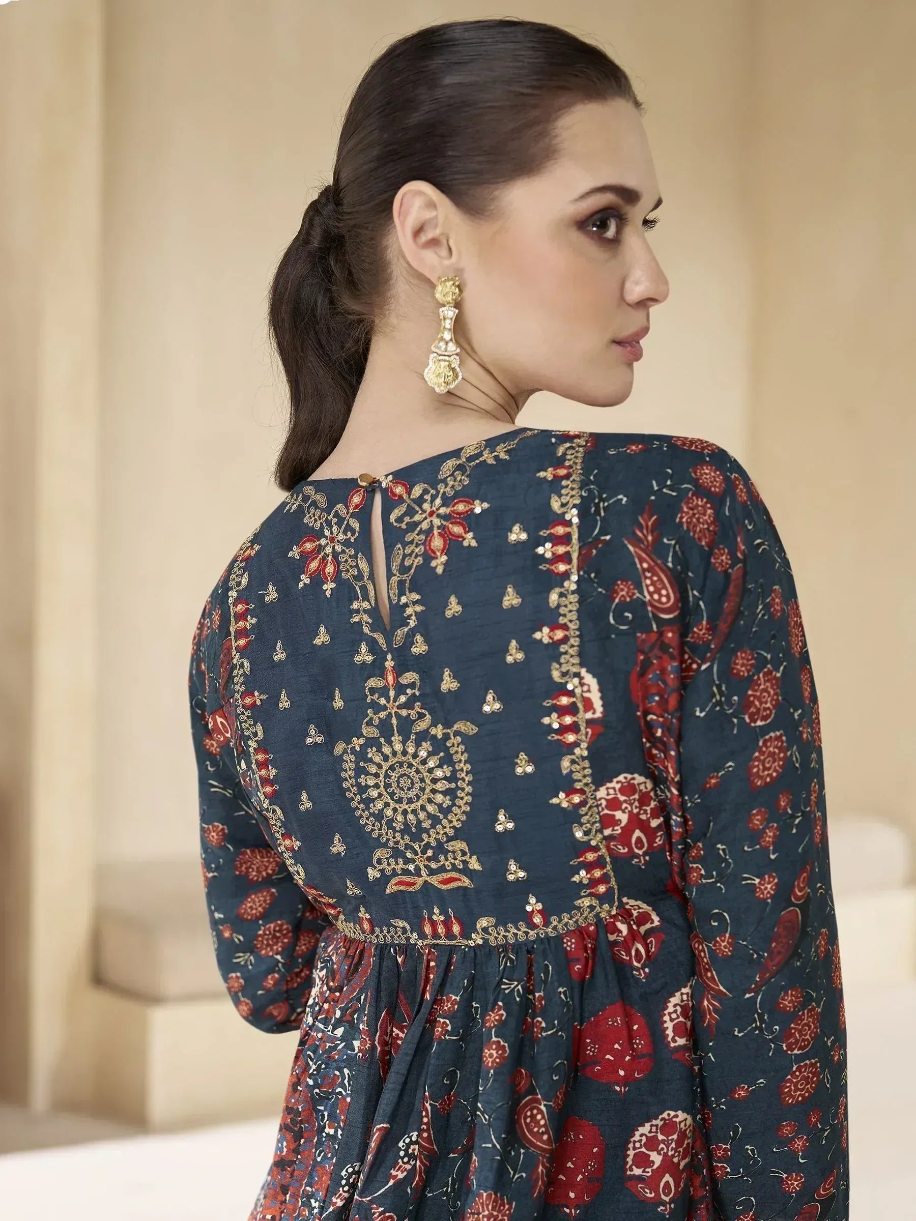 Navy blue ethnic gown with red floral print and gold embroidery, back view with keyhole detail