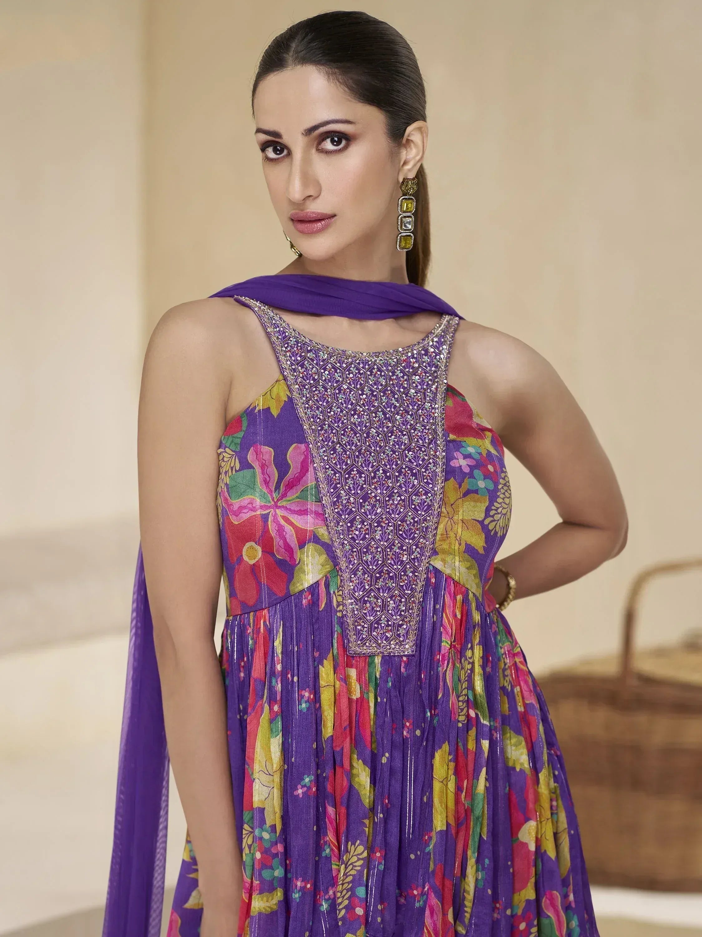 Purple floral printed ethnic gown with embroidered neckline and matching dupatta
