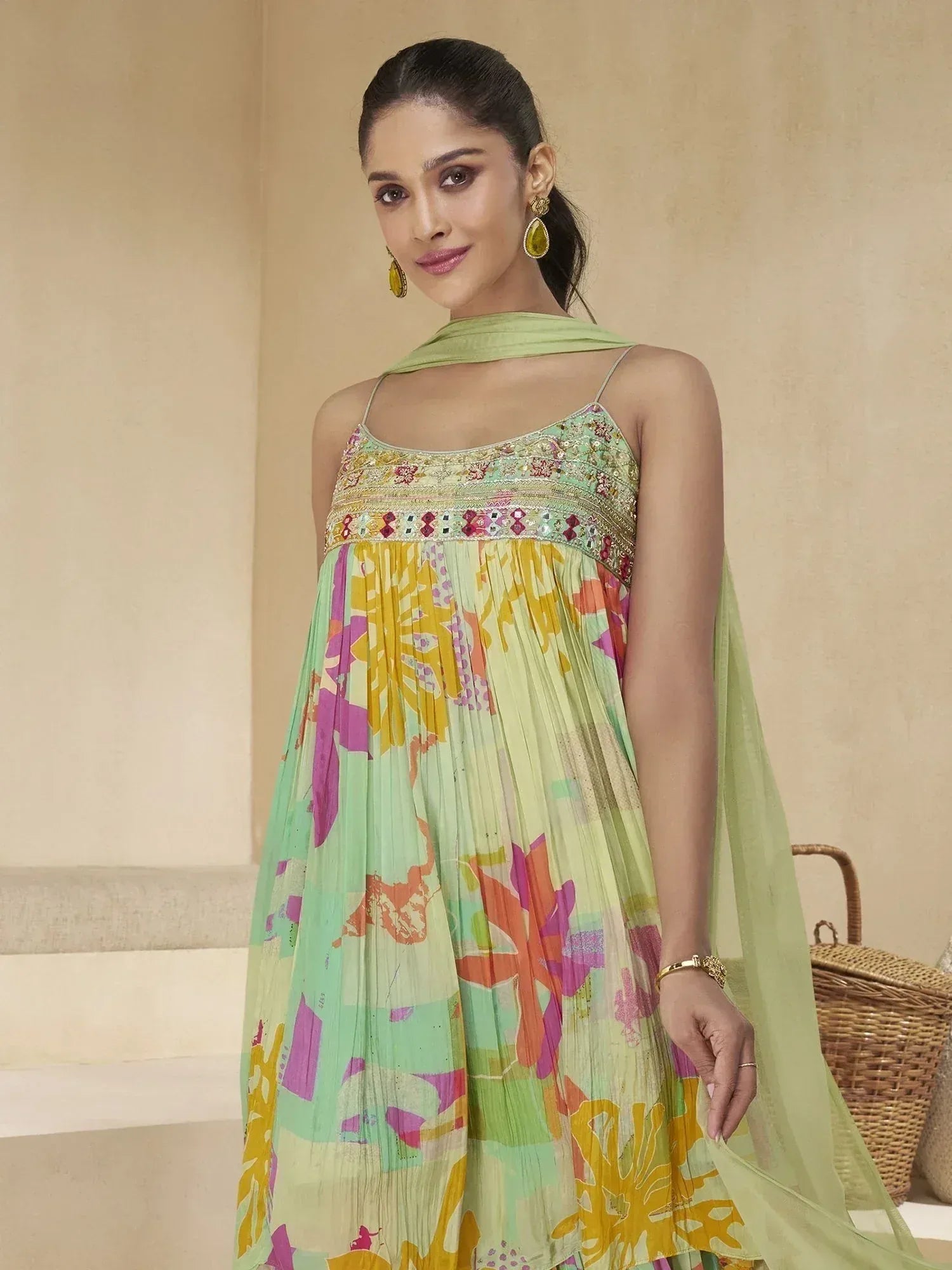 Floral print ethnic gown with embroidered neckline and matching dupatta, perfect for Indian occasions.