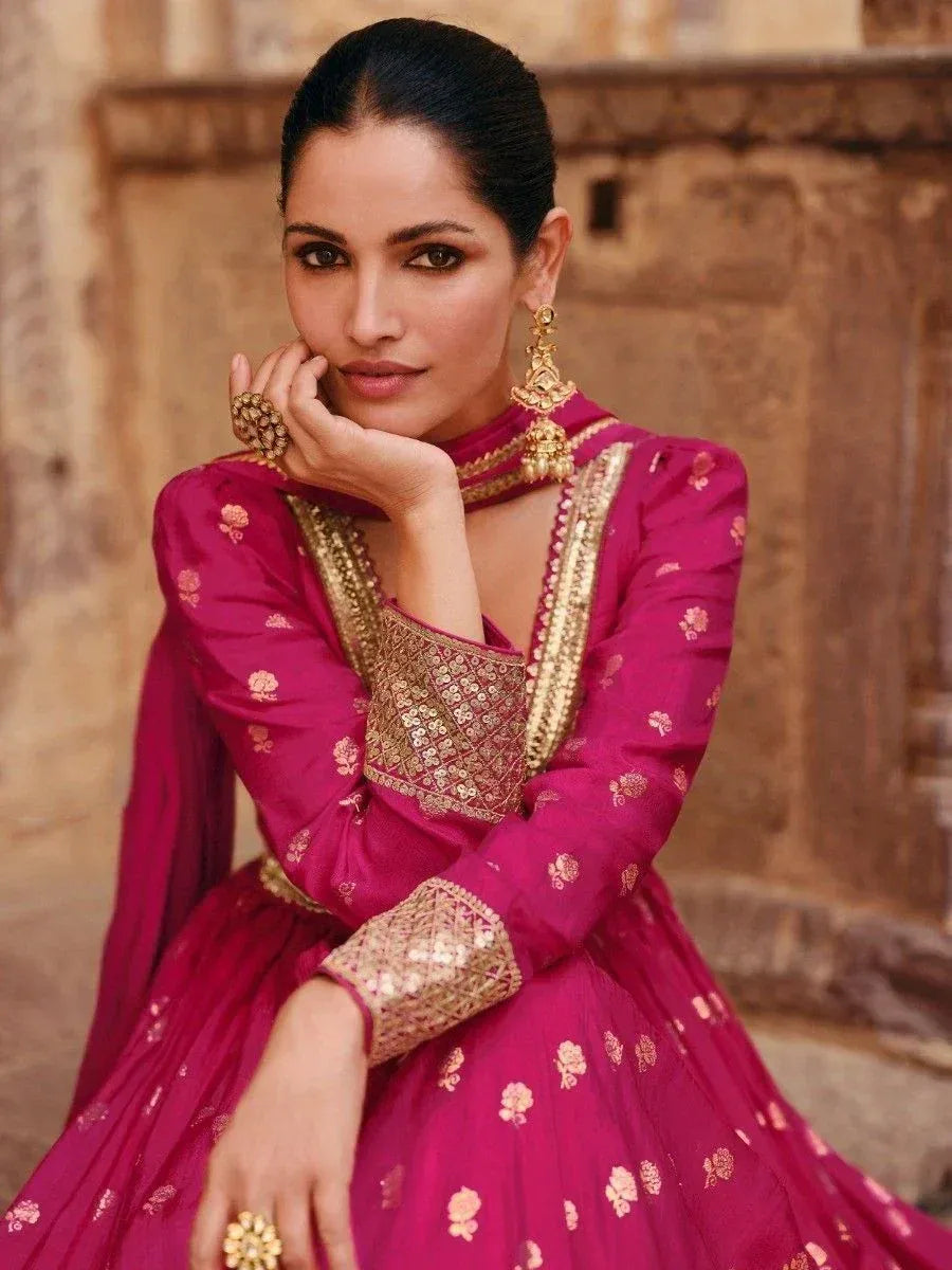 Elegant magenta lehenga choli with gold embroidery, perfect for Indian ethnic wear and festive occasions.