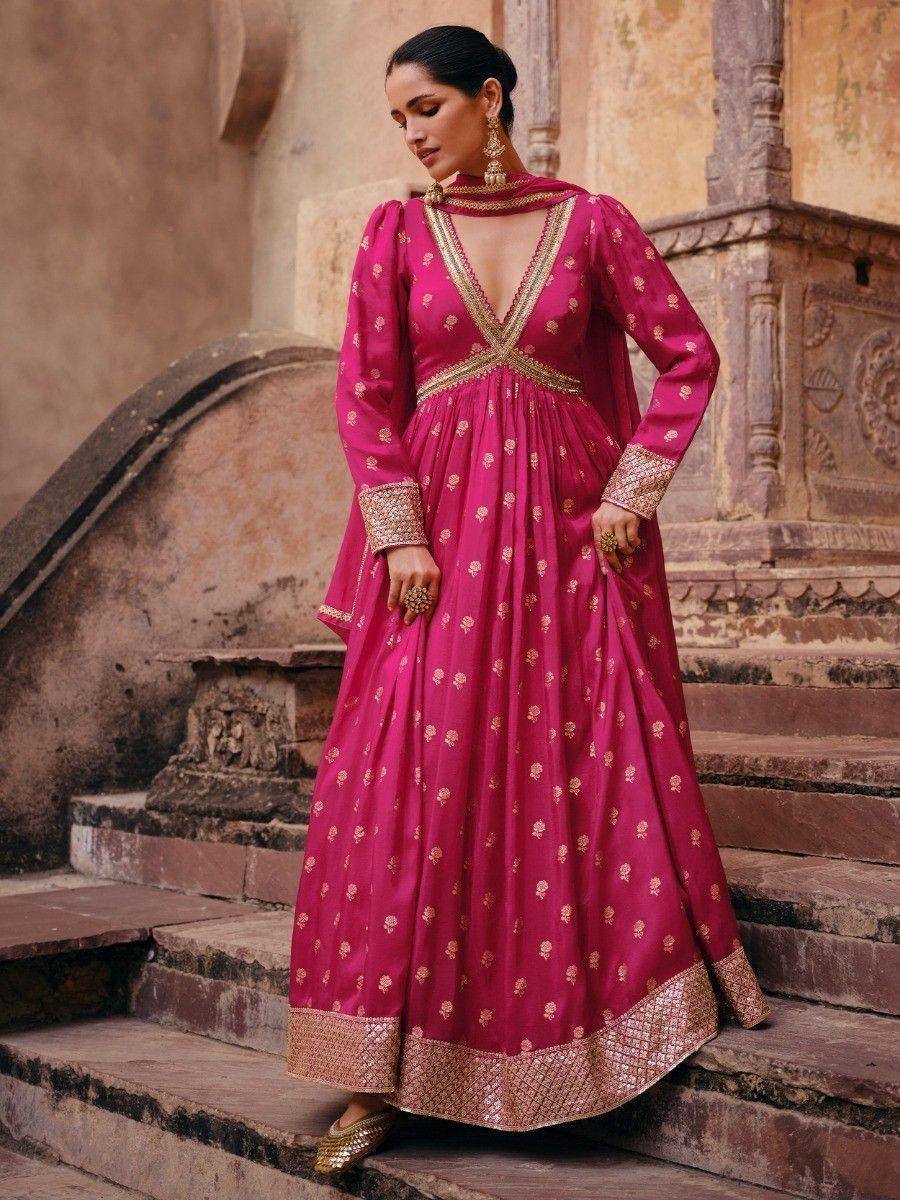 Pink ethnic gown with gold embroidery, perfect for Indian weddings and festive occasions.