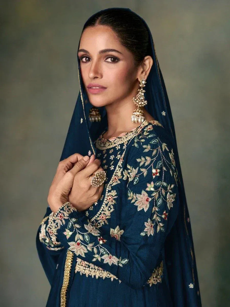 Elegant navy blue embroidered salwar kameez with floral detailing and matching dupatta, perfect for Indian ethnic occasions.
