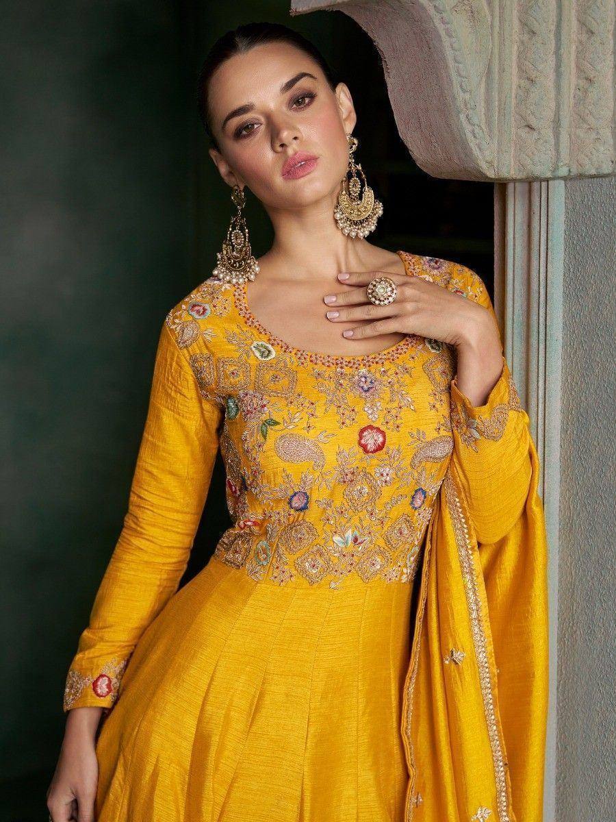 Yellow embroidered ethnic gown with floral motifs, perfect for Indian festive occasions and weddings.