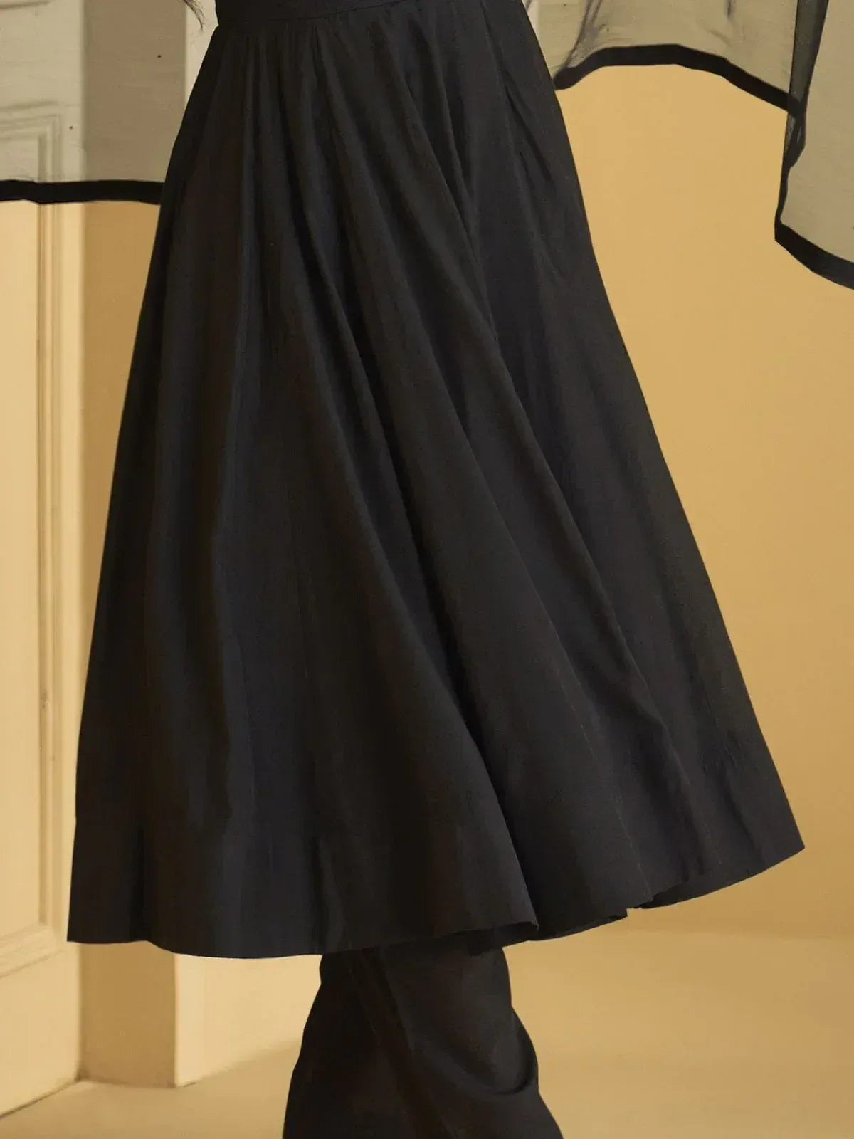 Black flared ethnic skirt with sheer overlay, stylish Indian wear for women