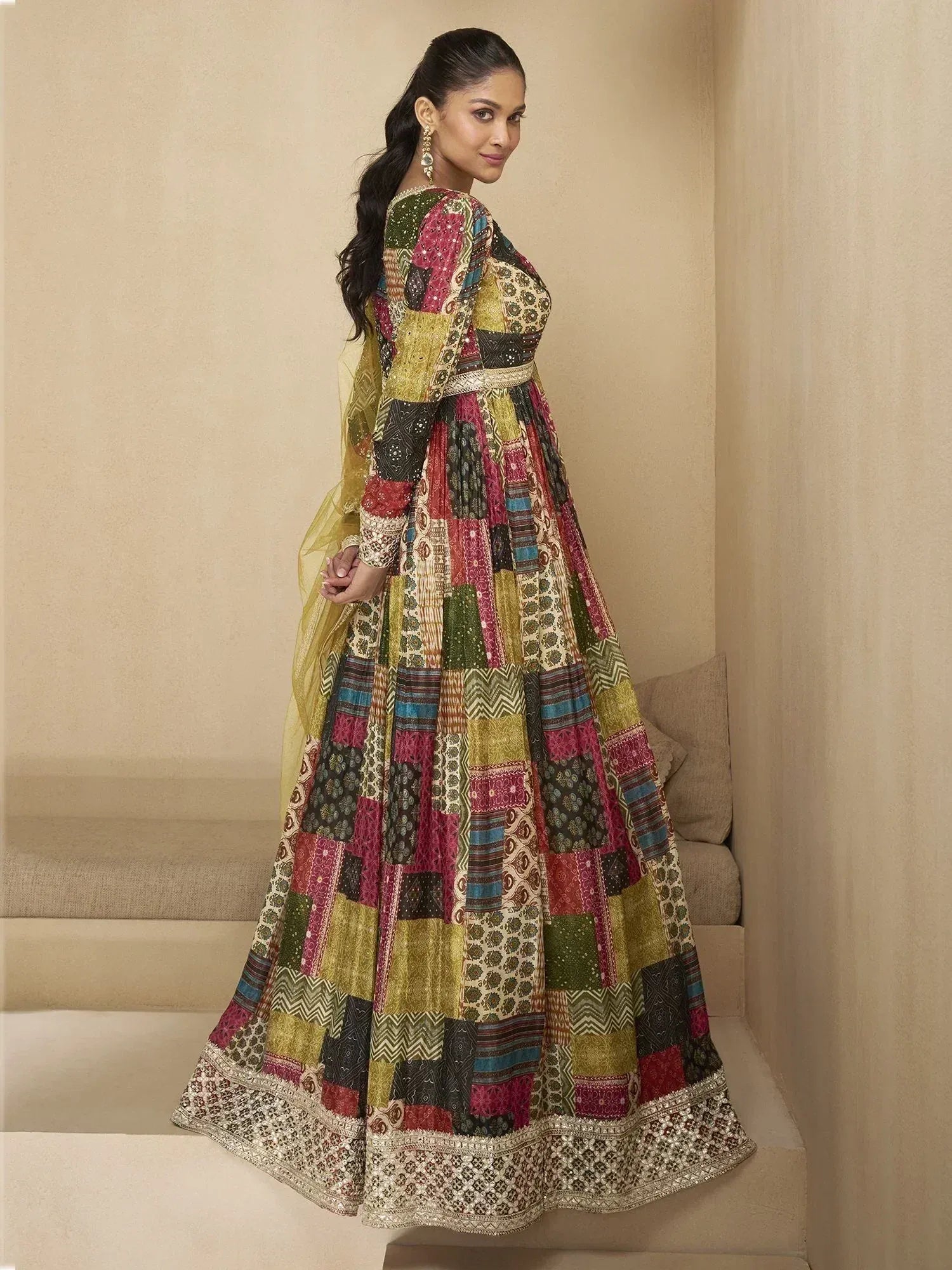 Woman in colorful patchwork Indian anarkali suit with embroidery, perfect for ethnic occasions