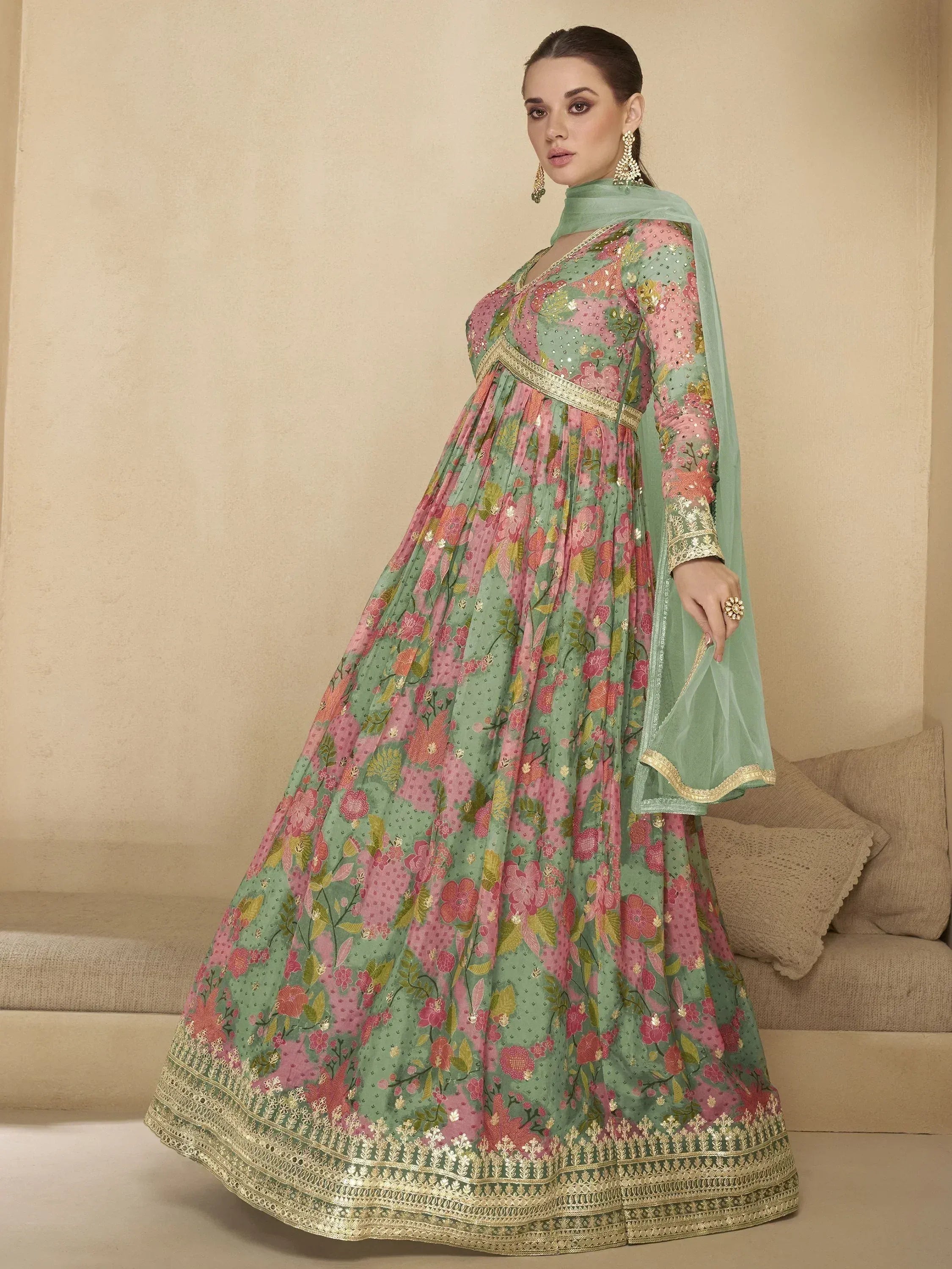 Floral print green and pink anarkali suit with gold embroidery, perfect for Indian ethnic wear occasions.
