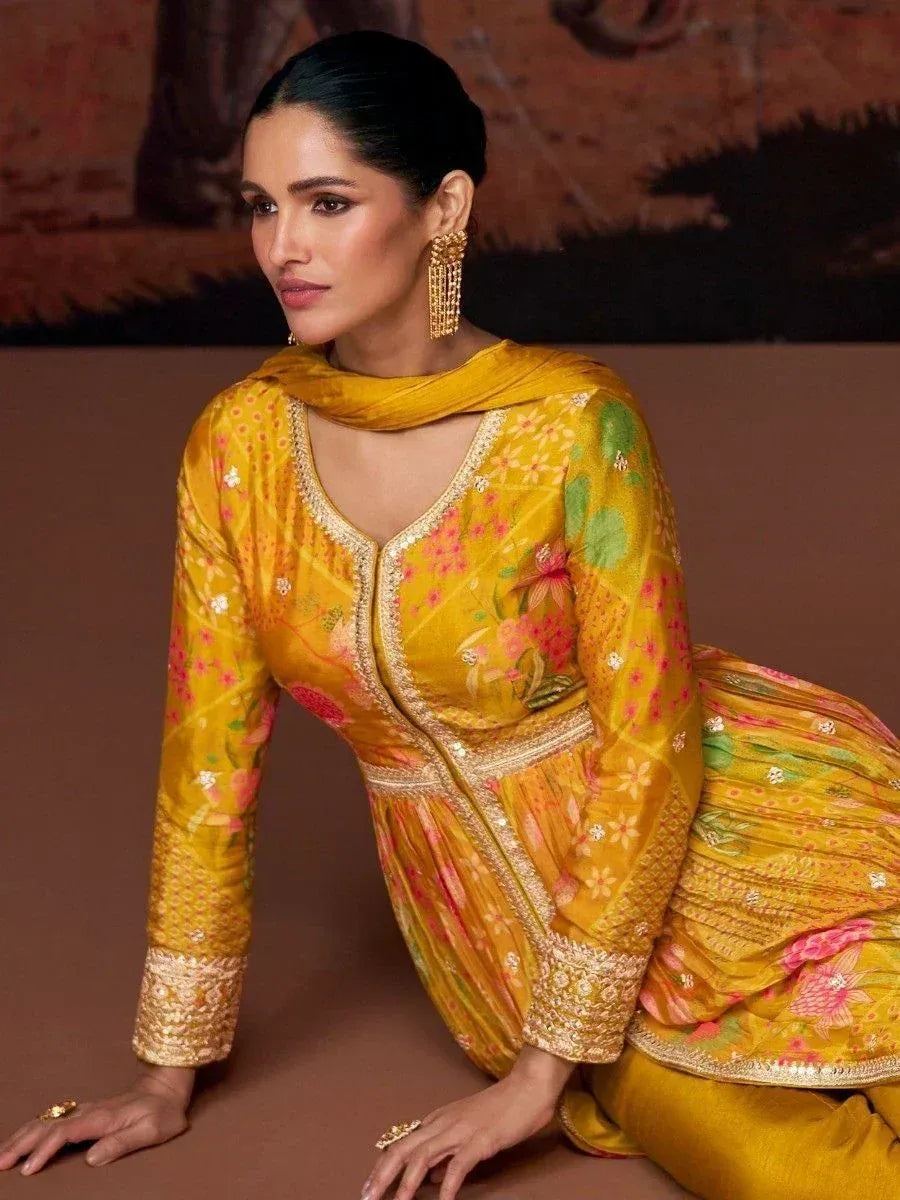 Yellow floral embroidered salwar kameez with gold detailing, perfect for ethnic occasions