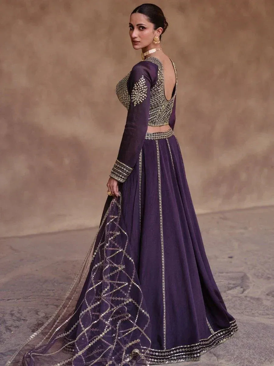 Purple designer lehenga choli with gold embroidery and sheer dupatta, ethnic Indian wear