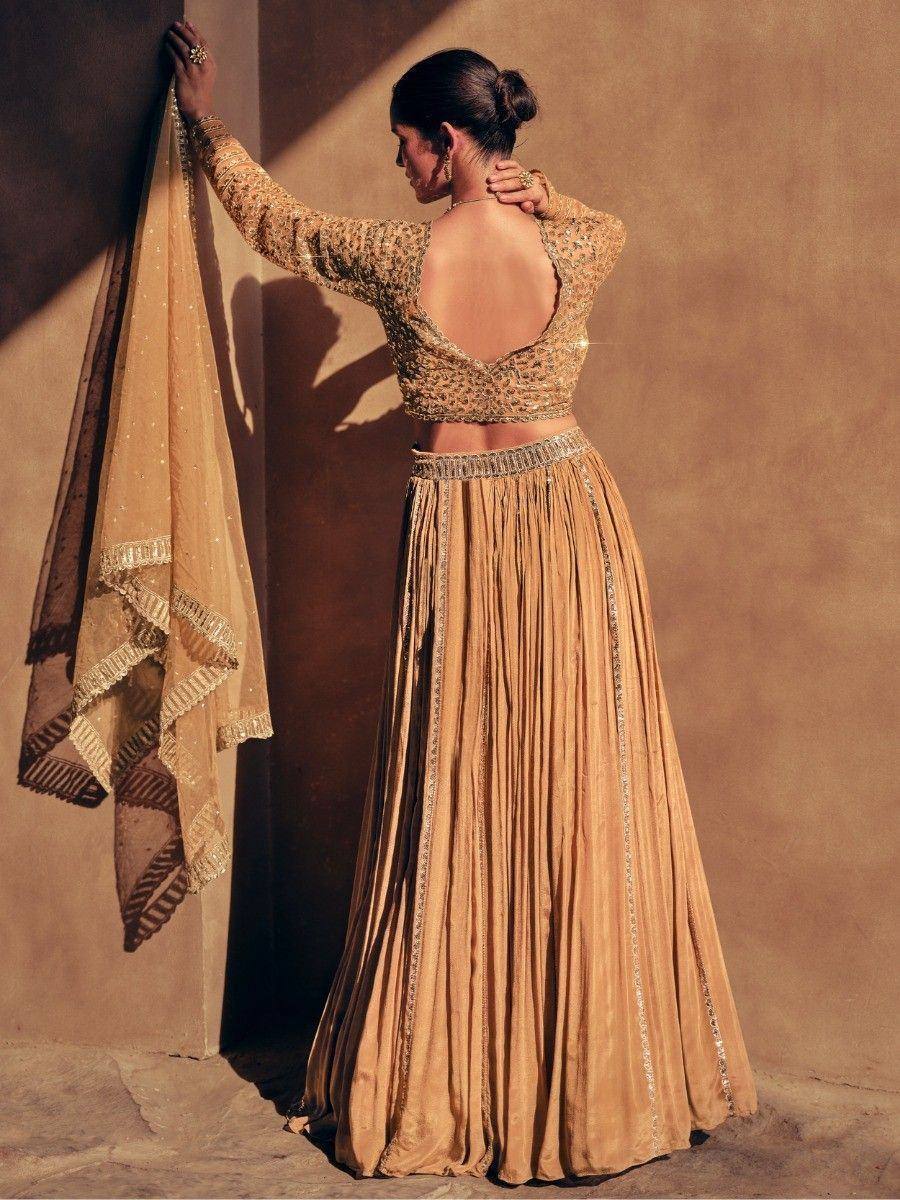 Gold embroidered lehenga choli with open back blouse and matching dupatta, ethnic Indian wear