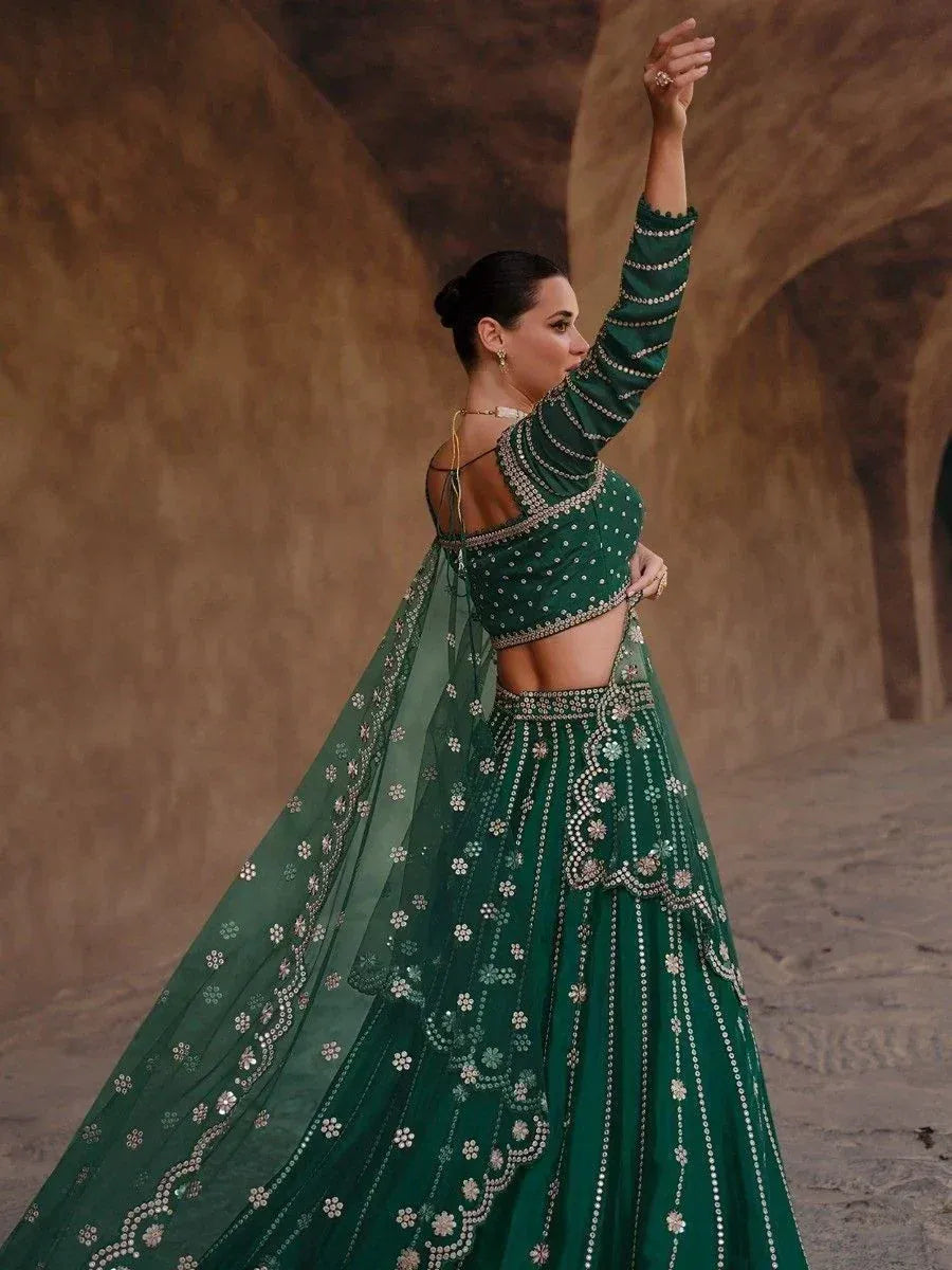 Emerald green designer lehenga choli with floral embroidery, perfect for Indian ethnic wear events