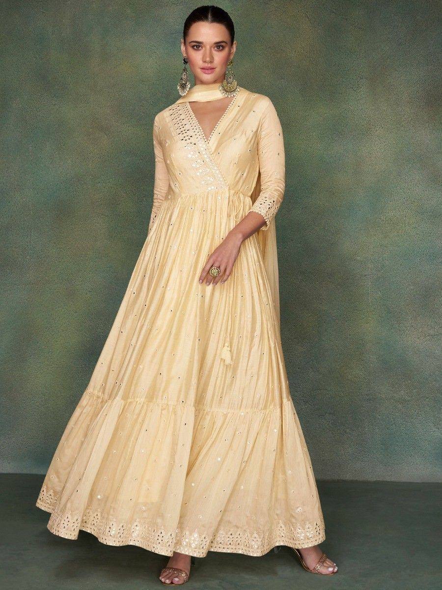 Elegant beige ethnic gown with mirror work, perfect for Indian occasions and festive wear