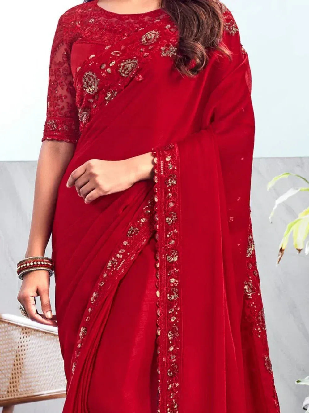 Red embroidered saree with gold detailing, perfect for Indian ethnic occasions