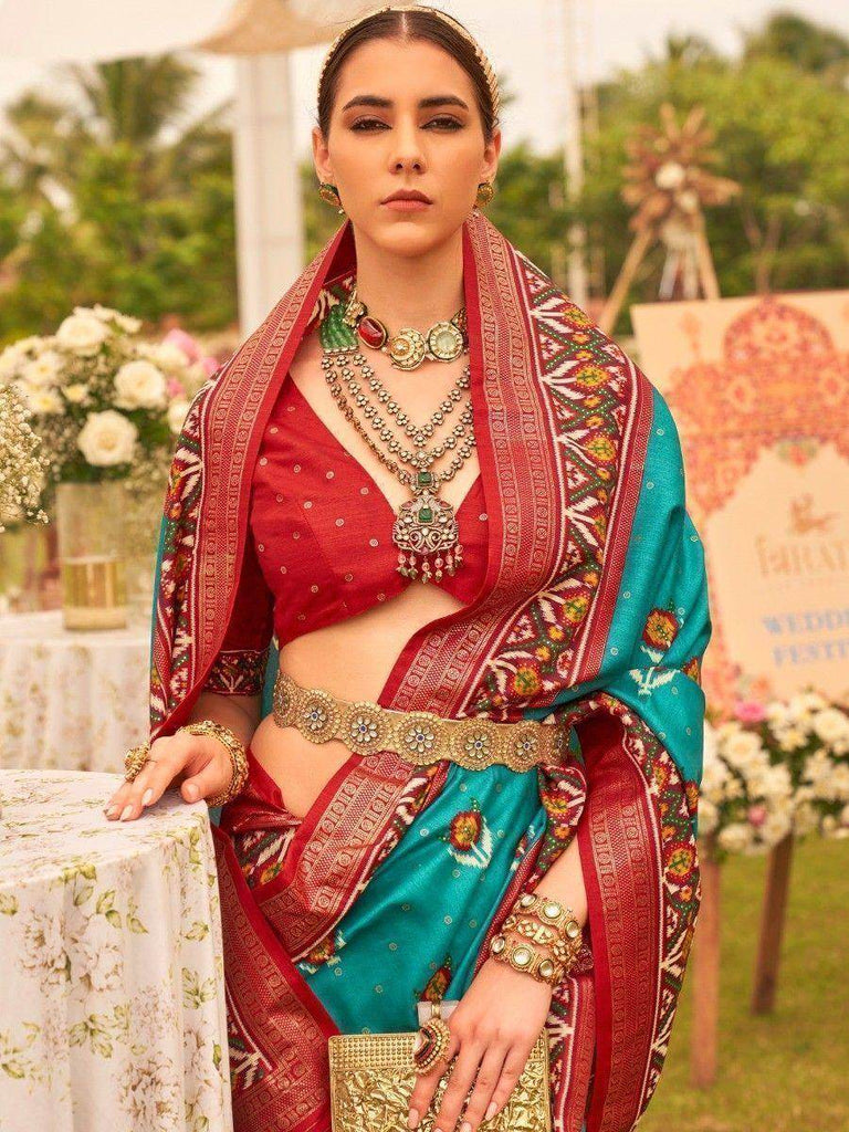 Dazzling Teal Blue Patola Printed Silk Function Wear Saree With Blouse