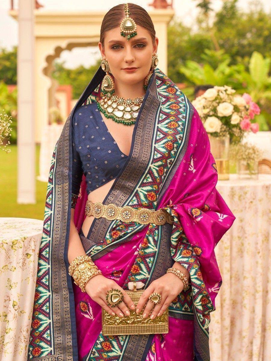 Elegant pink and blue ethnic saree with intricate embroidery, perfect for Indian weddings and festive occasions.