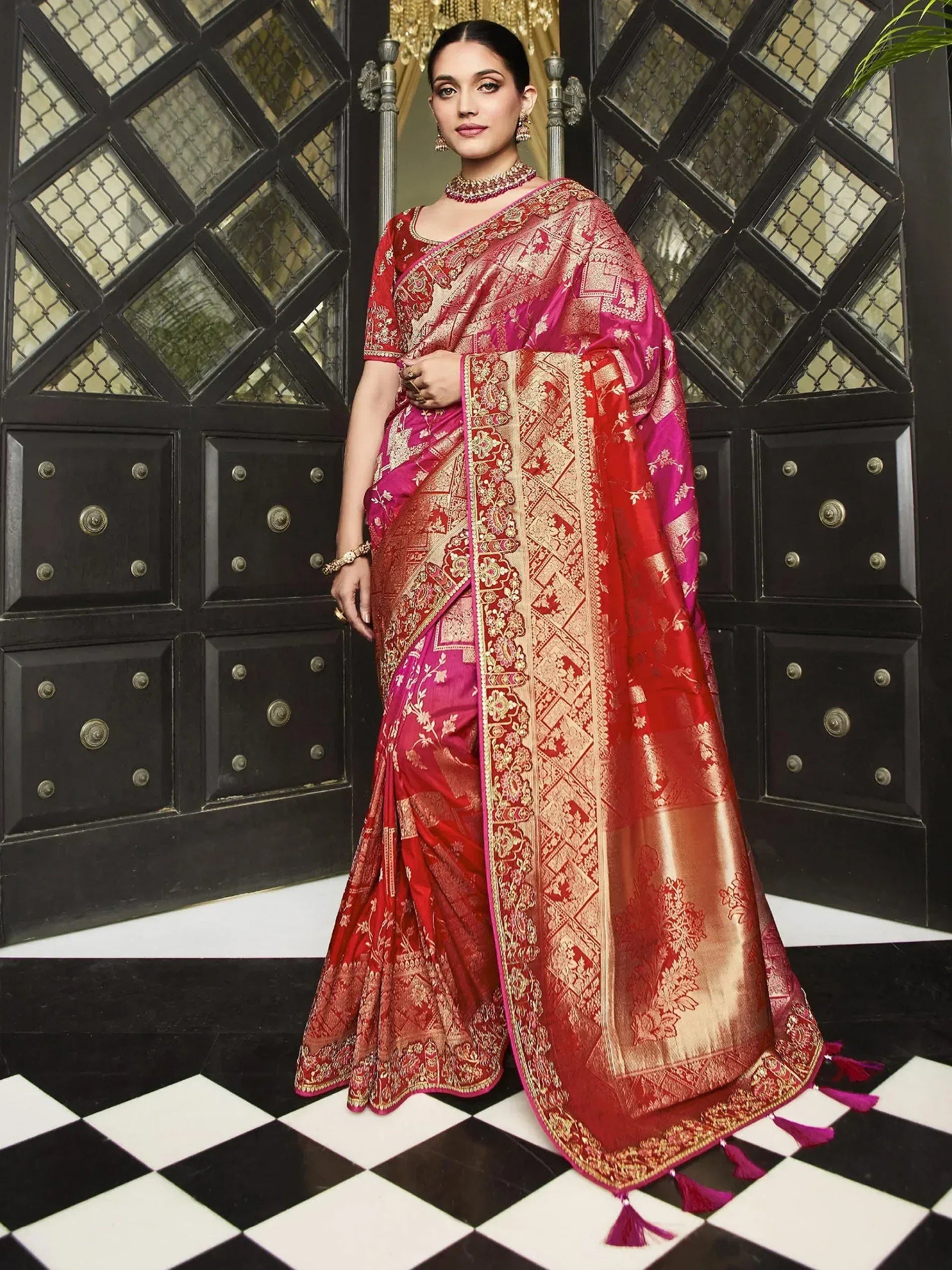 Elegant red and pink designer saree with gold zari work, perfect for Indian ethnic occasions