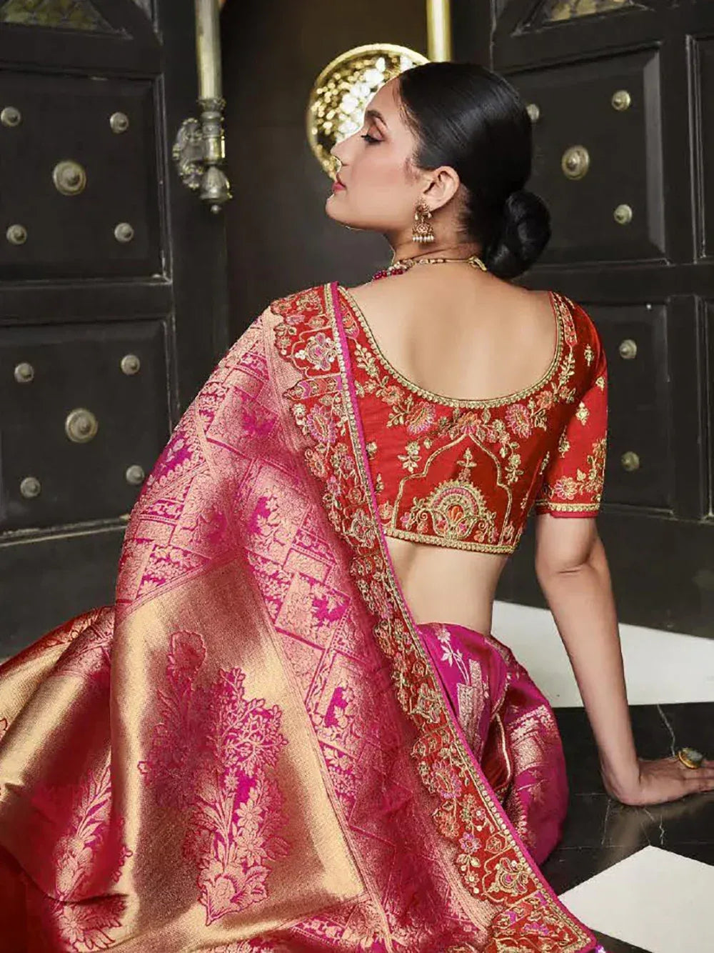 Red and pink embroidered saree with gold detailing, elegant ethnic wear for women