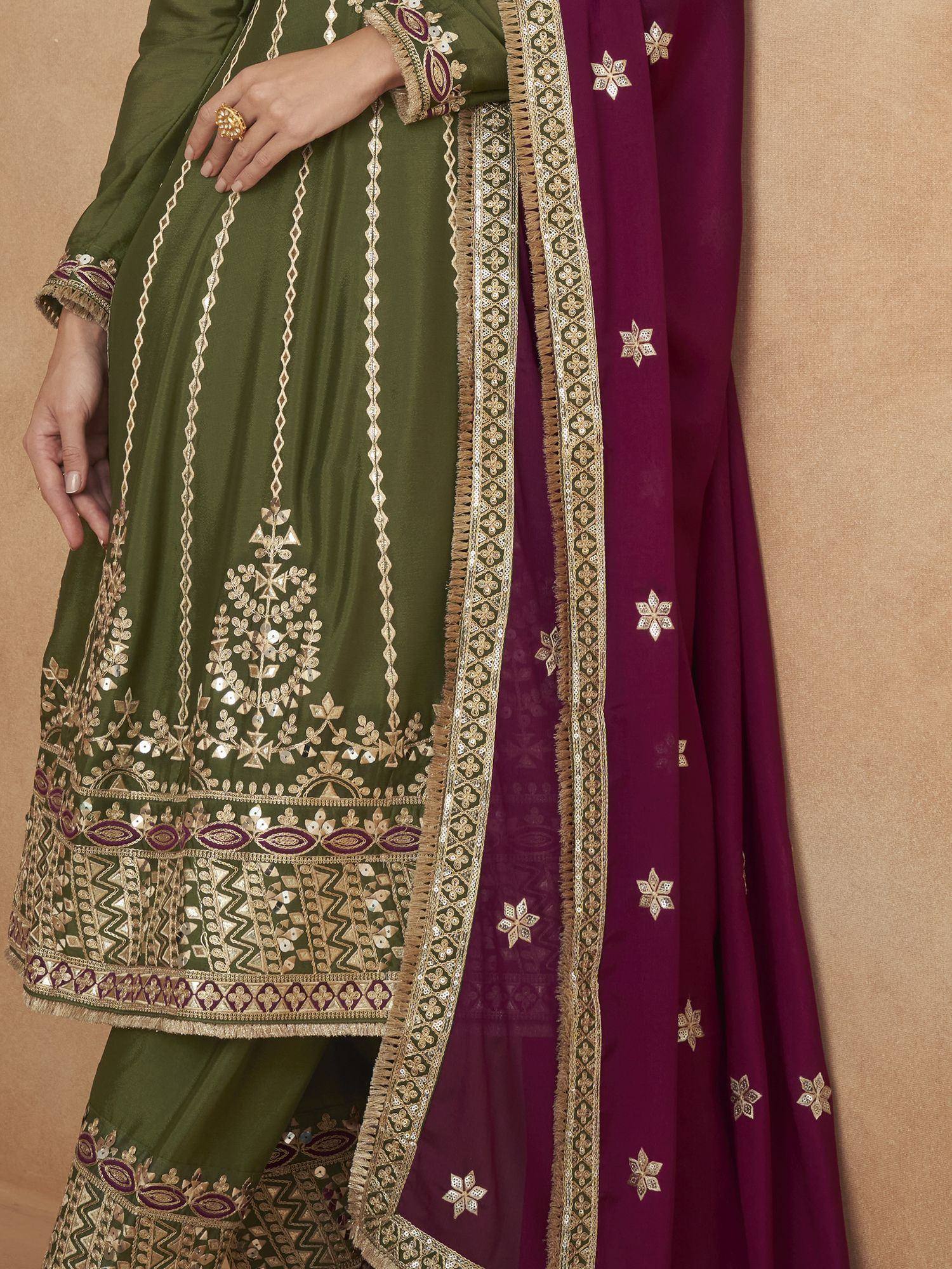 Olive green embroidered salwar kameez with maroon dupatta, featuring gold mirror work and intricate border detailing.
