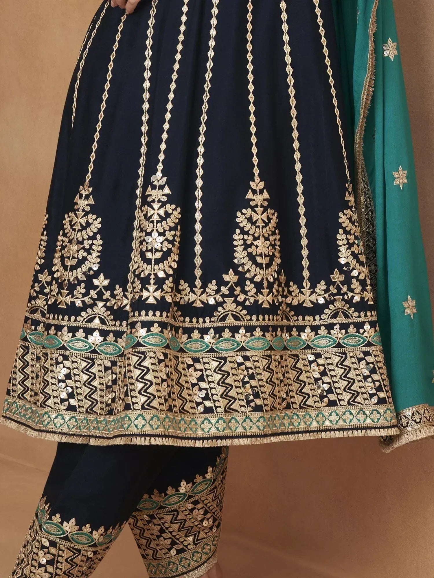 Navy blue ethnic anarkali with gold and green embroidery, paired with matching dupatta