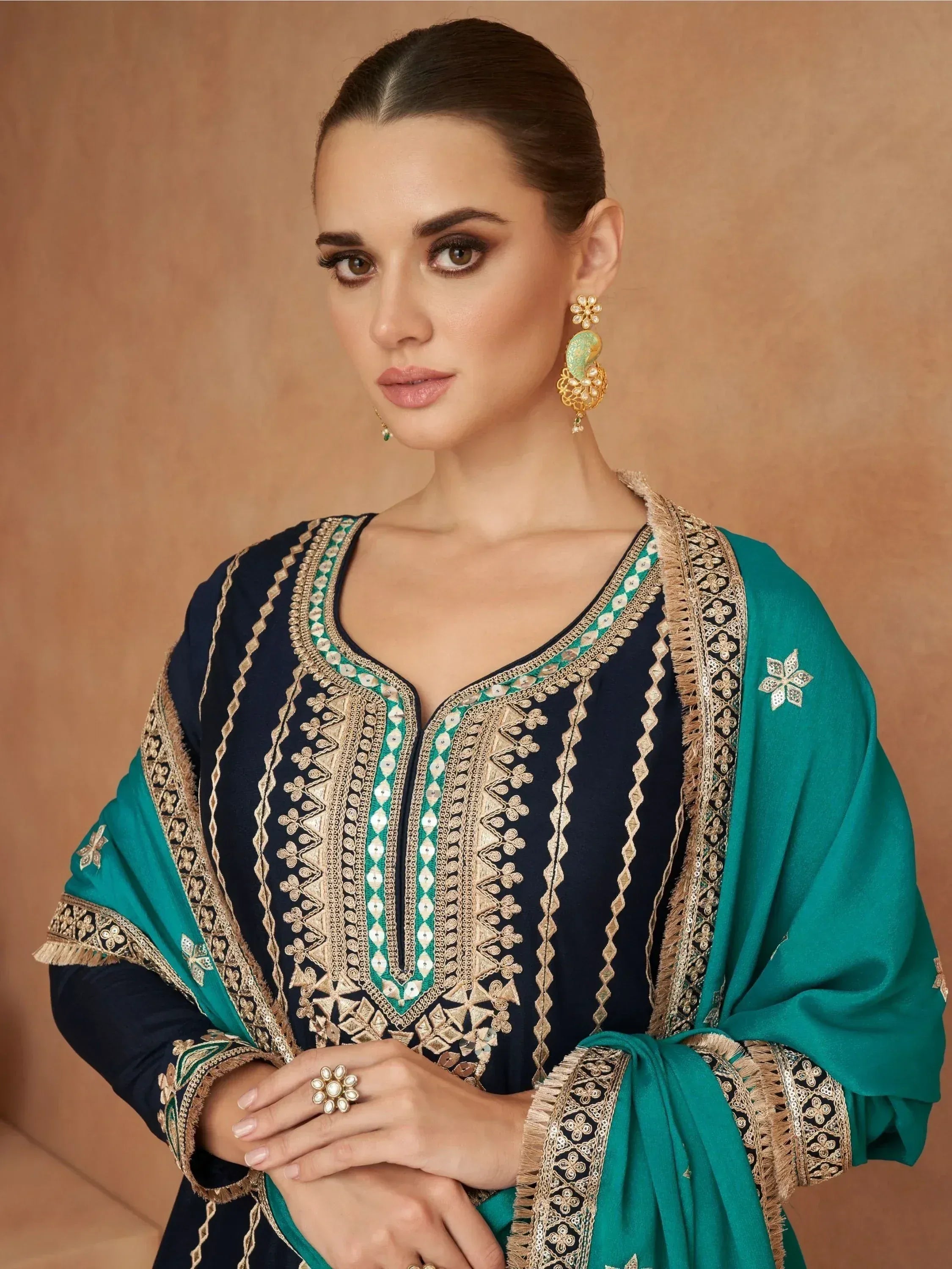 Elegant navy blue and teal embroidered salwar kameez with gold detailing and matching dupatta