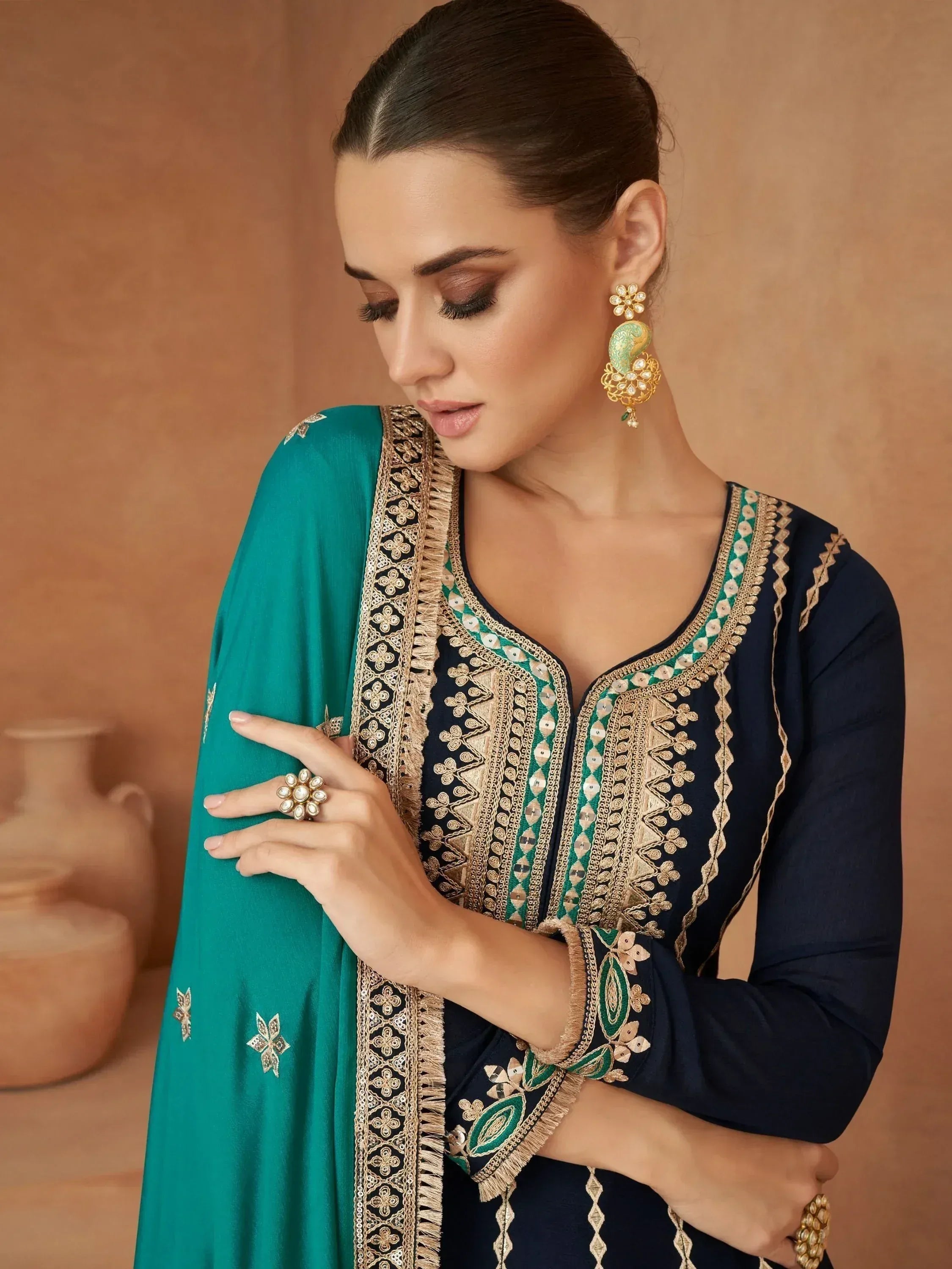 Elegant navy blue and teal embroidered salwar kameez with gold detailing and matching dupatta