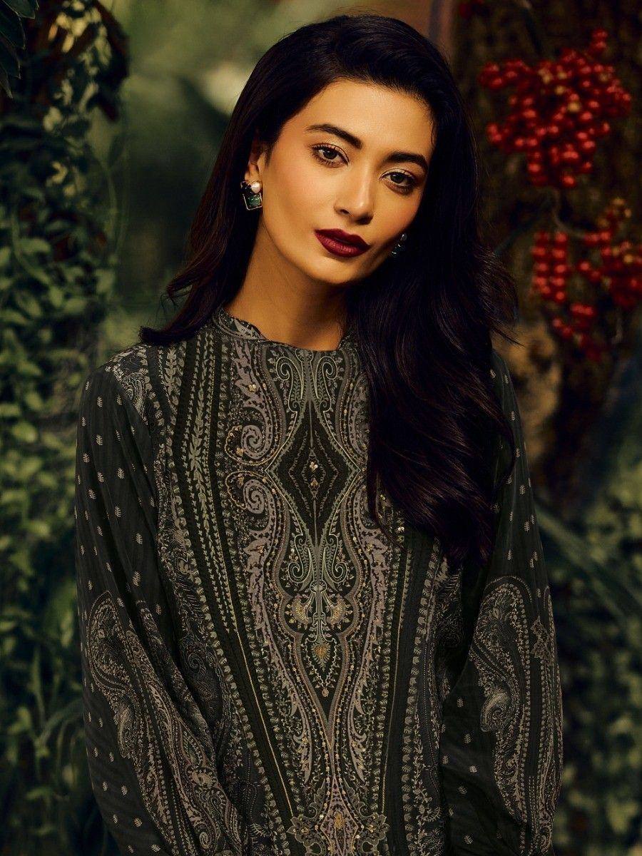 Woman in elegant black paisley printed ethnic kurta with intricate embroidery, perfect for festive occasions.