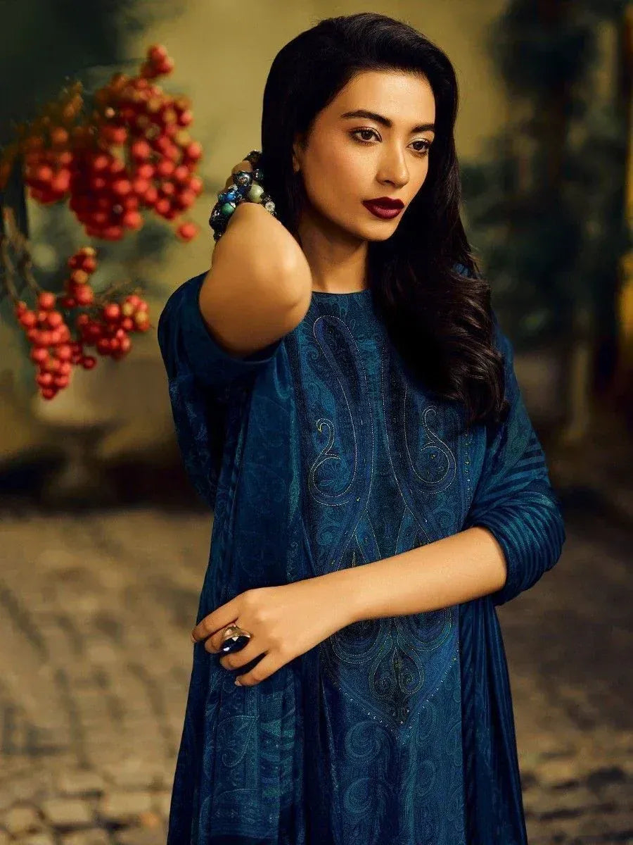 Woman in elegant blue embroidered ethnic gown with paisley design, perfect for Indian occasions