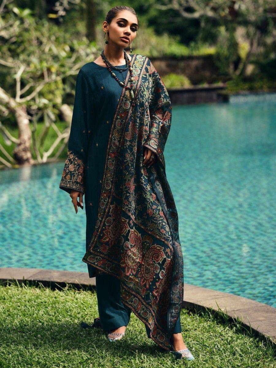Woman in teal floral embroidered salwar kameez by poolside, ethnic wear for women