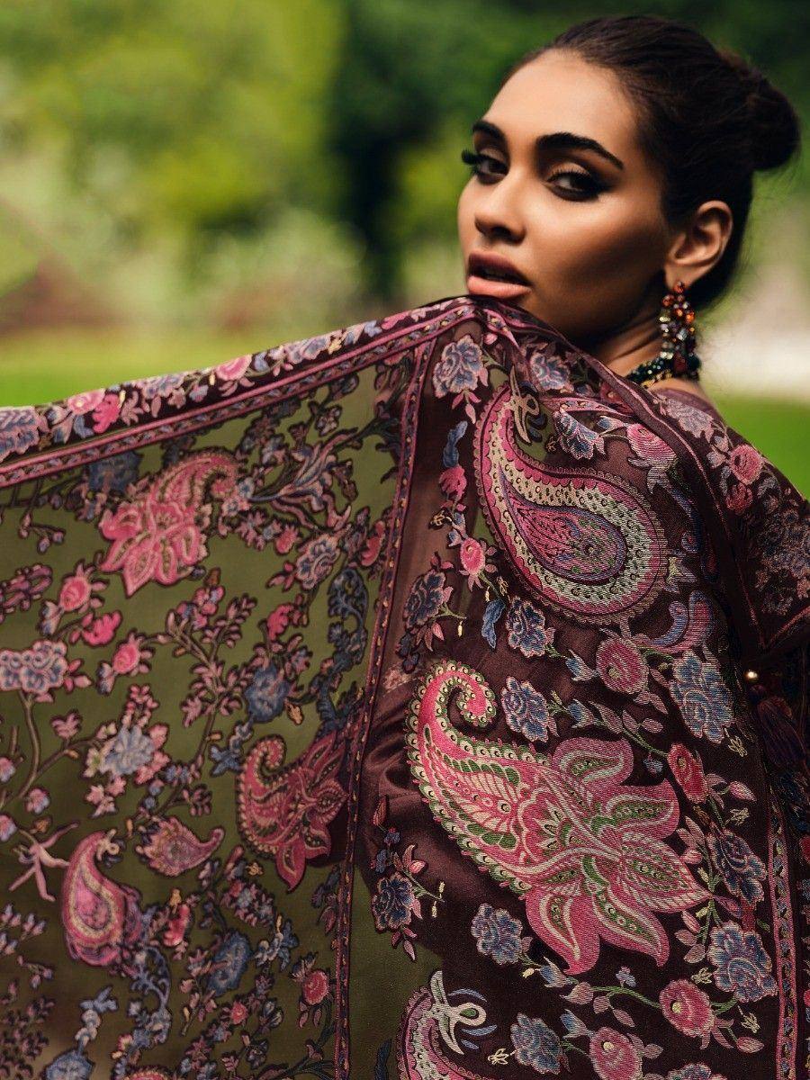 Woman in elegant Indian ethnic wear with intricate paisley and floral print, perfect for festive occasions.