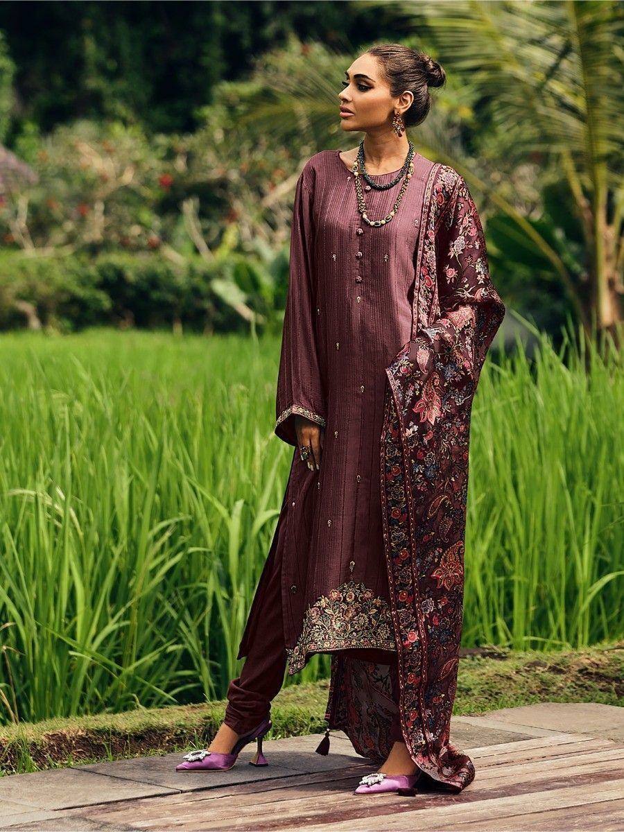 Elegant maroon salwar kameez with floral dupatta, perfect for ethnic occasions and festive wear.
