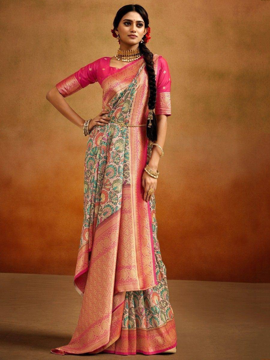 Pink floral printed saree with gold border, styled with matching blouse and traditional jewelry for ethnic wear