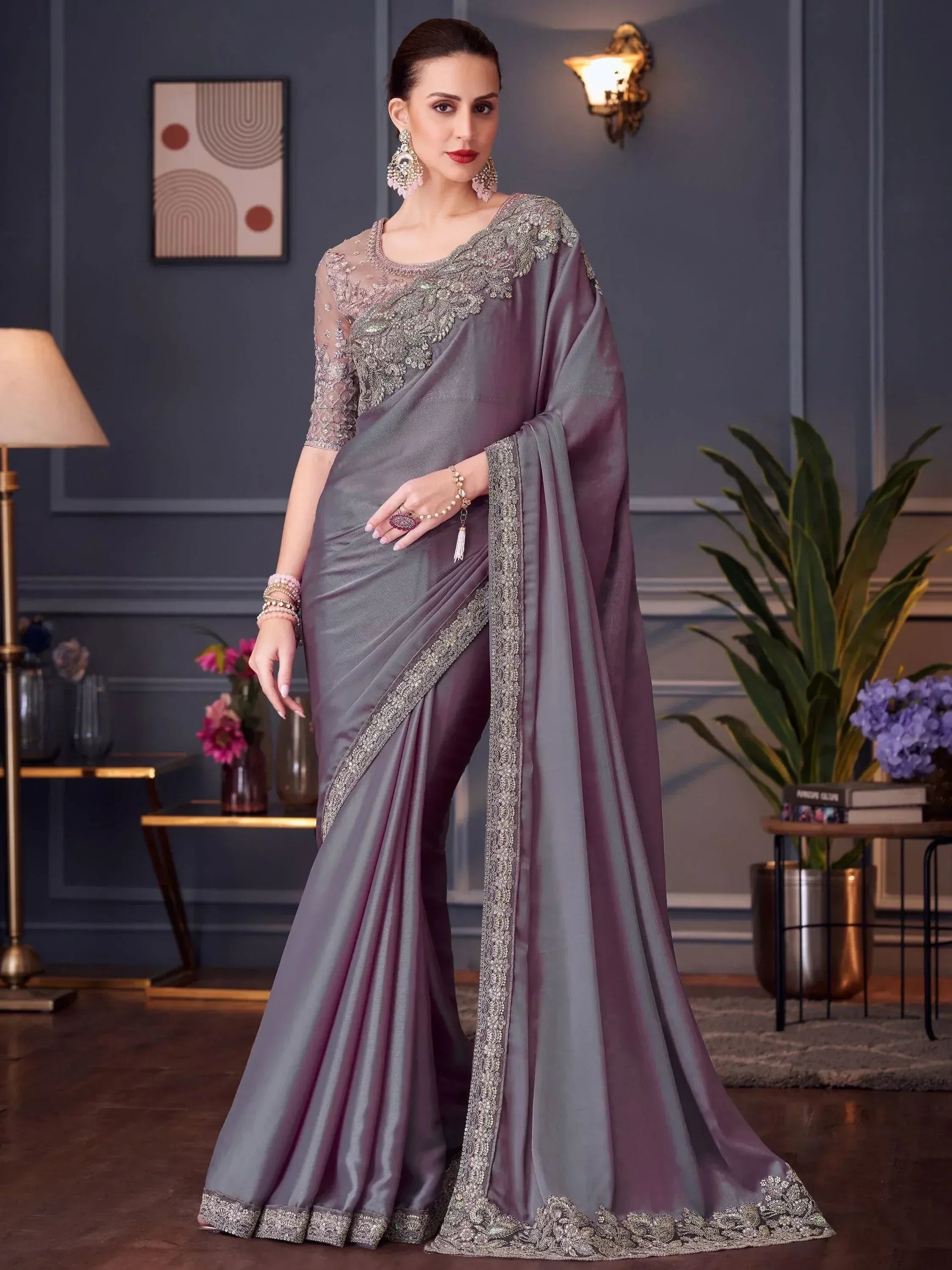 Elegant grey designer saree with heavy silver embroidery, perfect for Indian ethnic wear occasions.