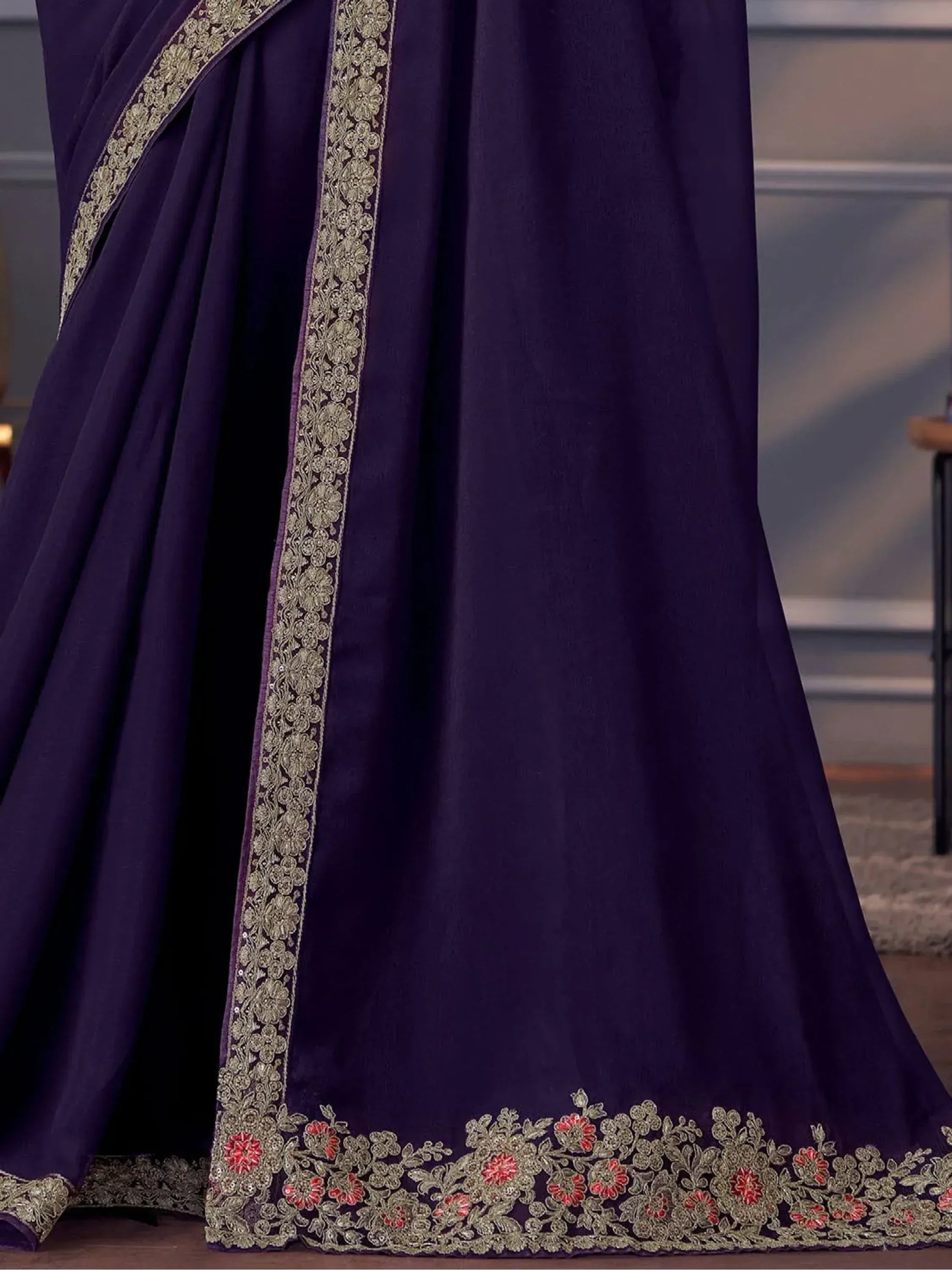 Purple designer saree with gold and red floral embroidery, perfect for ethnic occasions