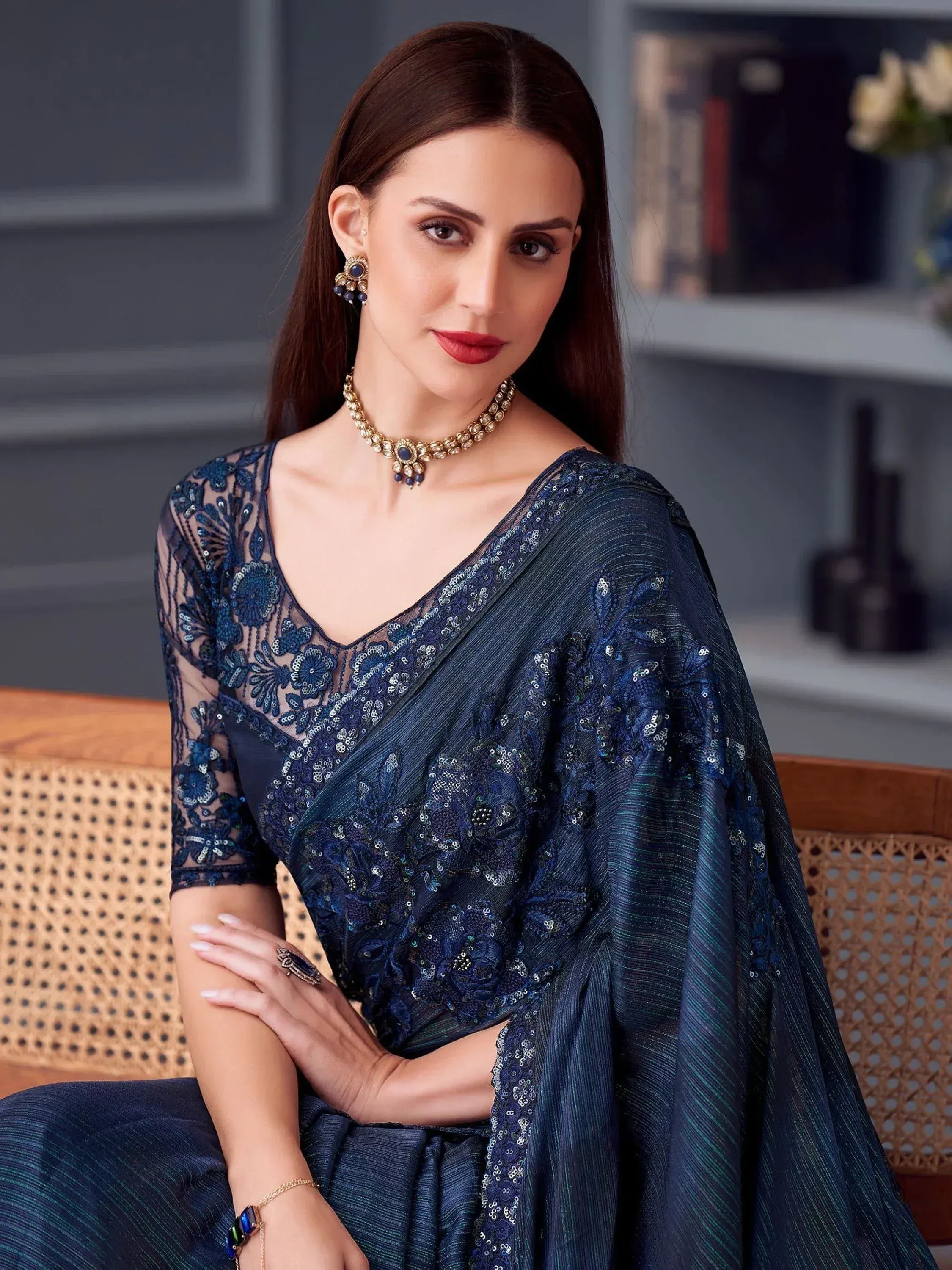 Elegant navy blue embroidered saree with sheer blouse, perfect for Indian ethnic wear occasions