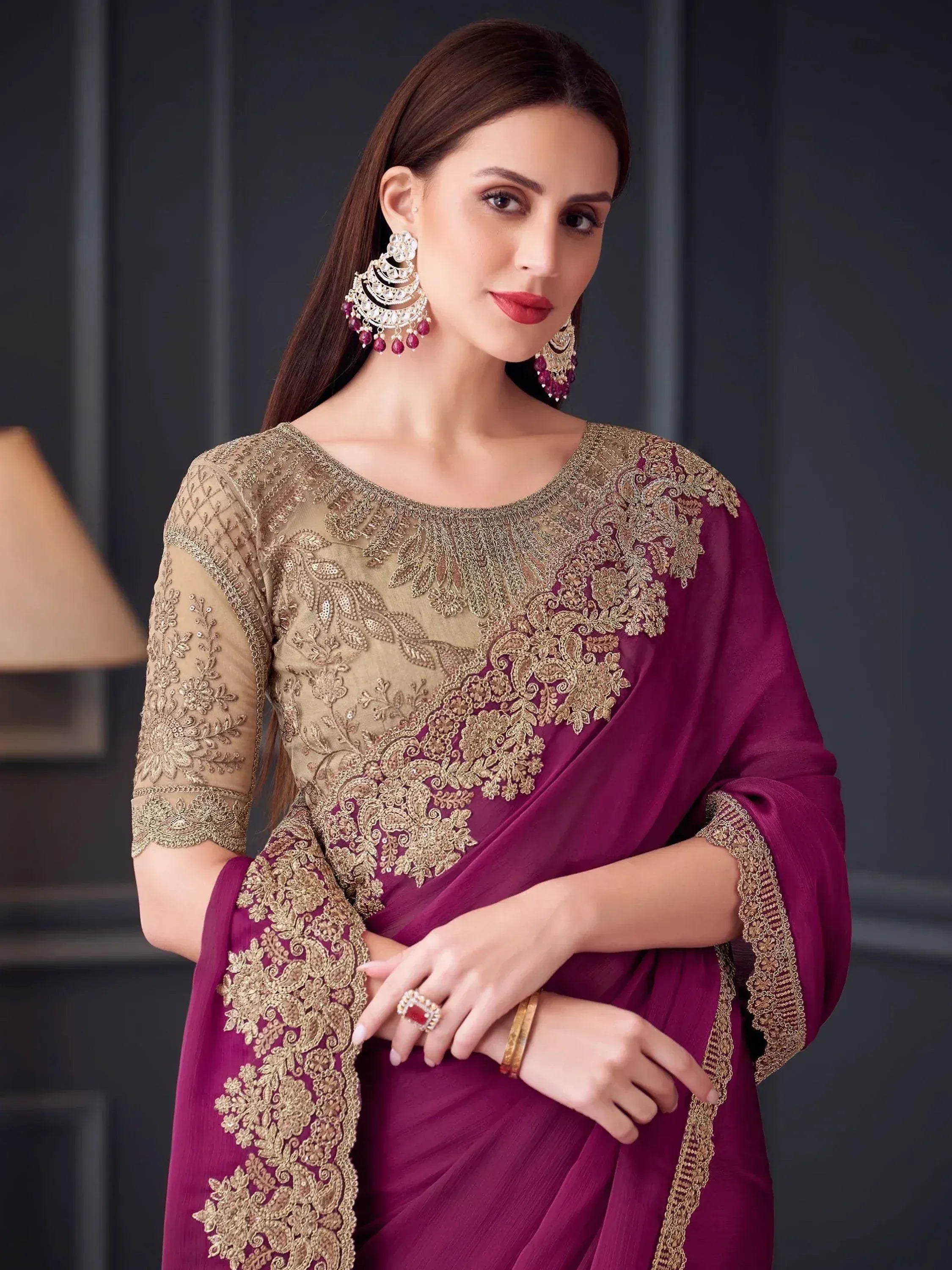 Elegant maroon and gold embroidered saree with designer blouse, perfect for Indian ethnic occasions.