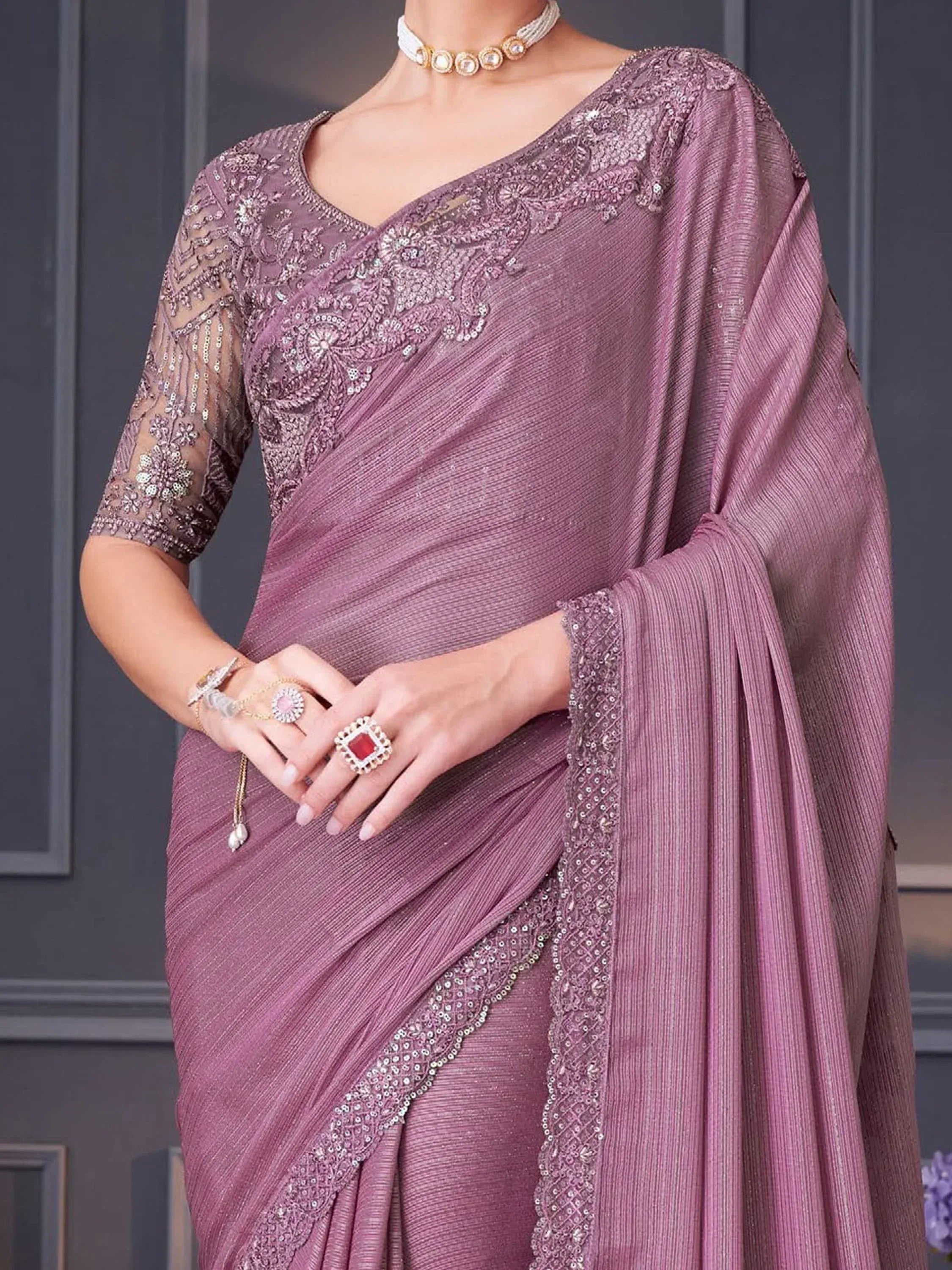 Elegant mauve saree with intricate embroidery and sequin work, perfect for Indian ethnic occasions.