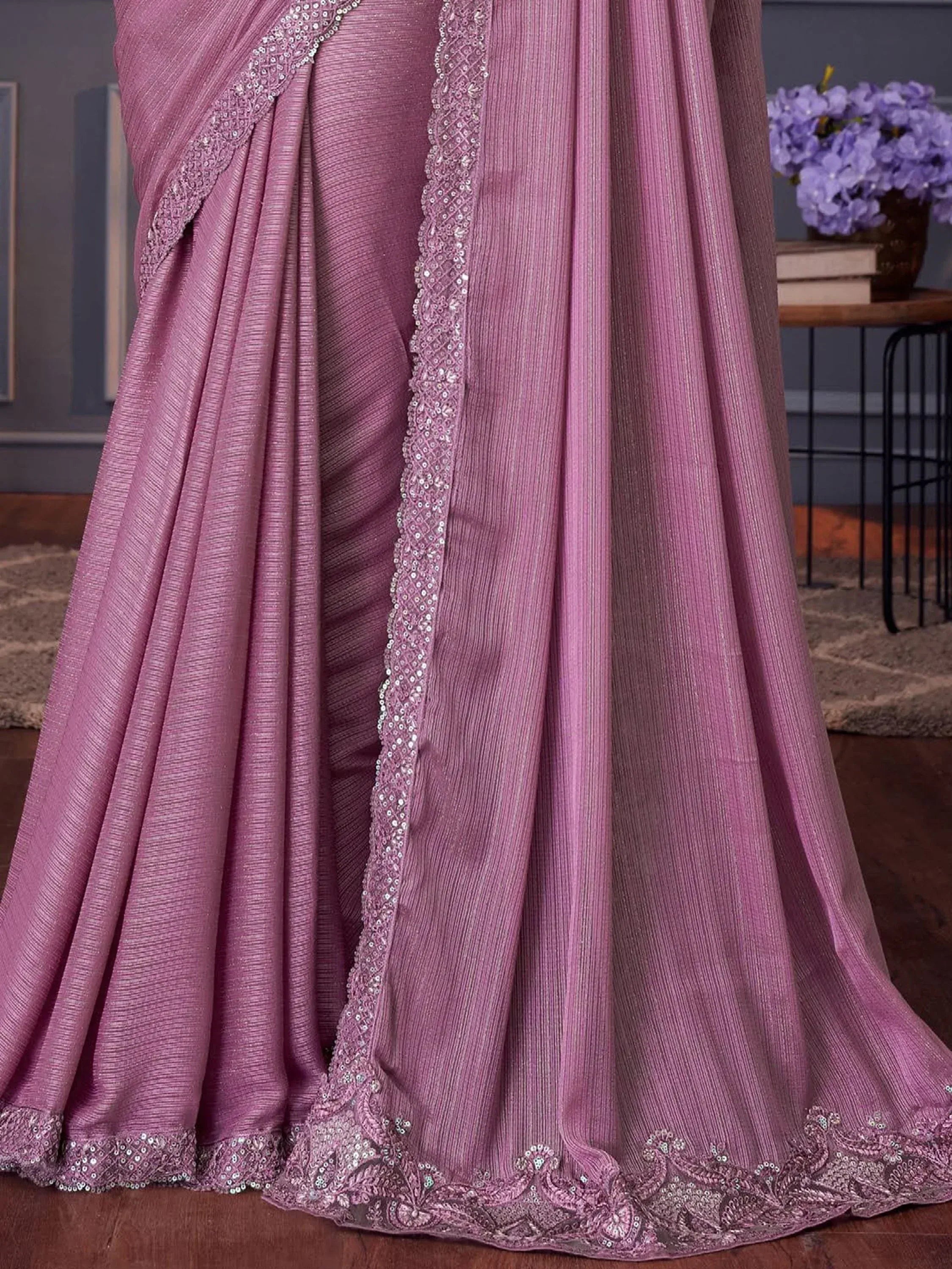 Pink ethnic saree with sequin embroidery and textured fabric, perfect for Indian occasions