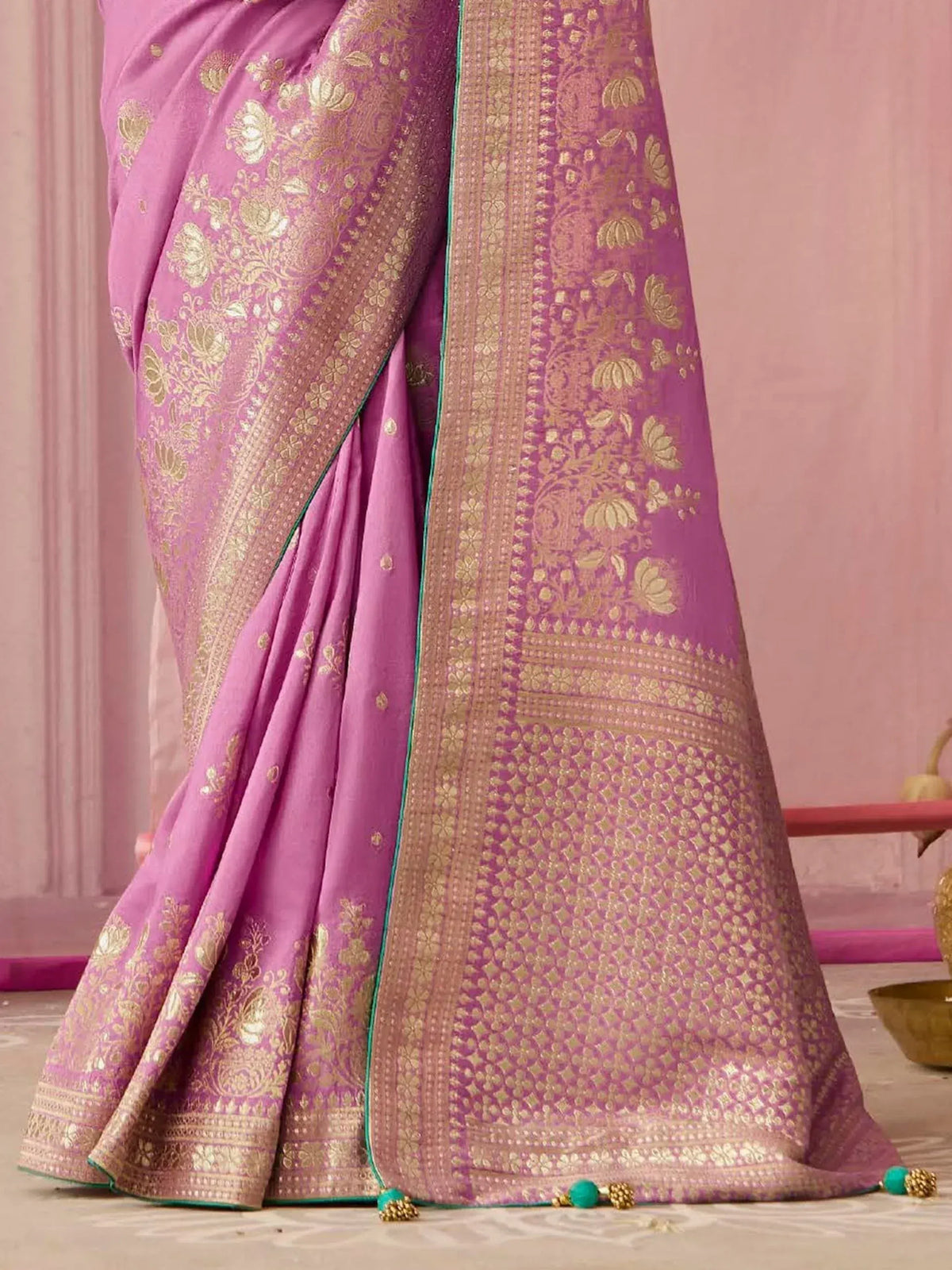 Pink Indian saree with gold floral embroidery and green border, traditional ethnic wear