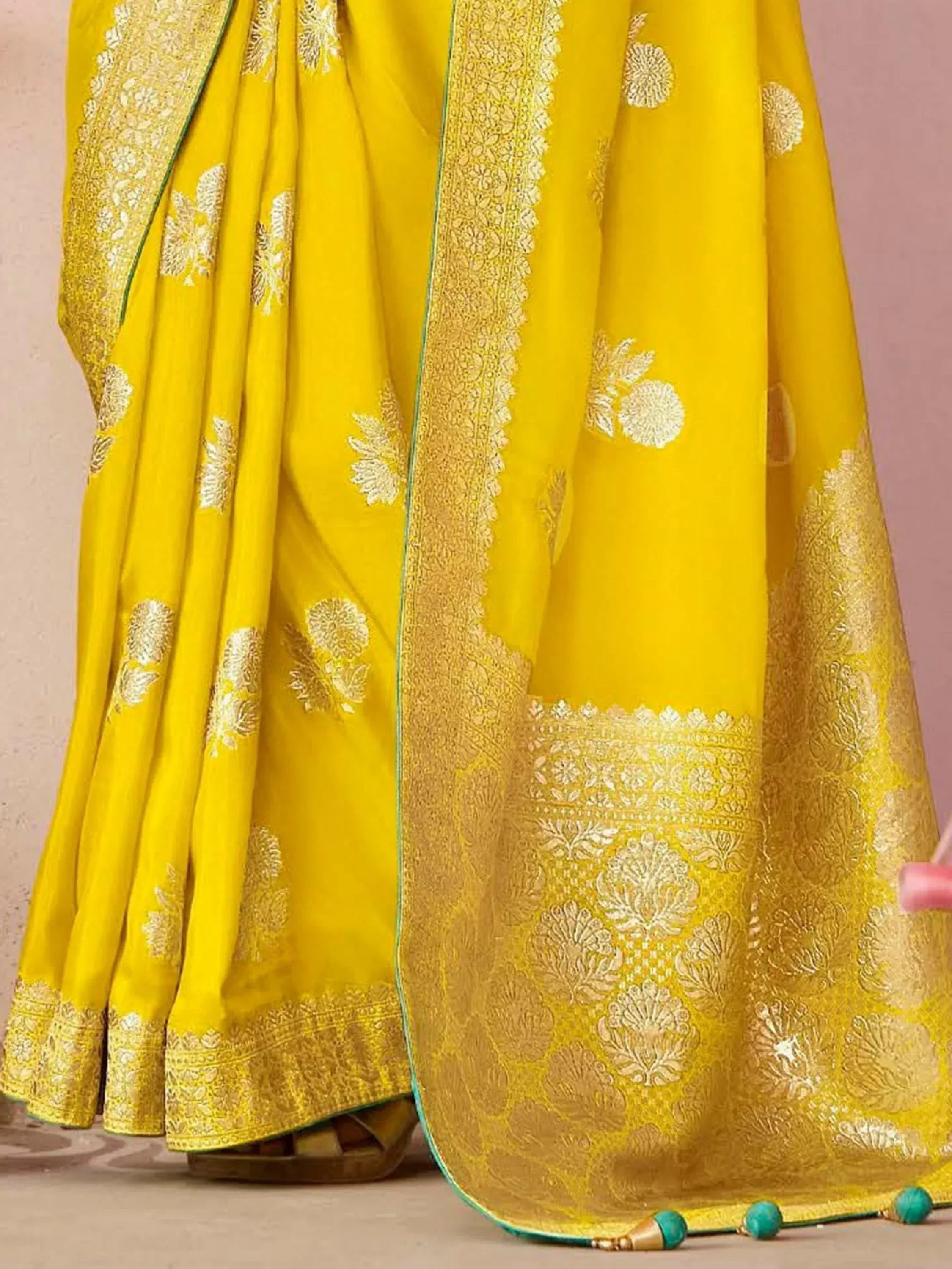 Vibrant yellow saree with gold floral embroidery and rich border, perfect for Indian ethnic occasions