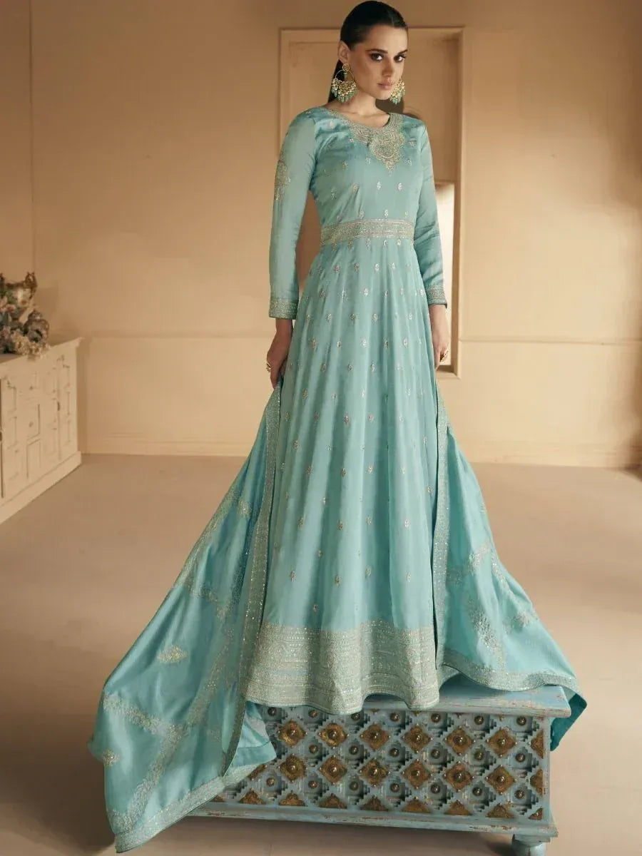 Elegant light blue ethnic gown with gold embroidery, perfect for Indian weddings and festive occasions