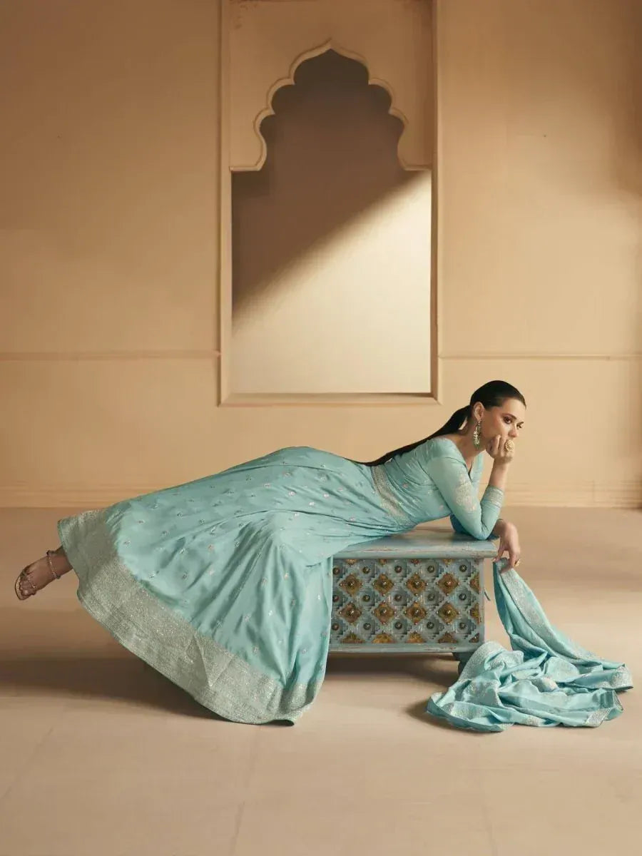 Elegant mint green designer saree with gold embroidery, styled for Indian ethnic wear occasions