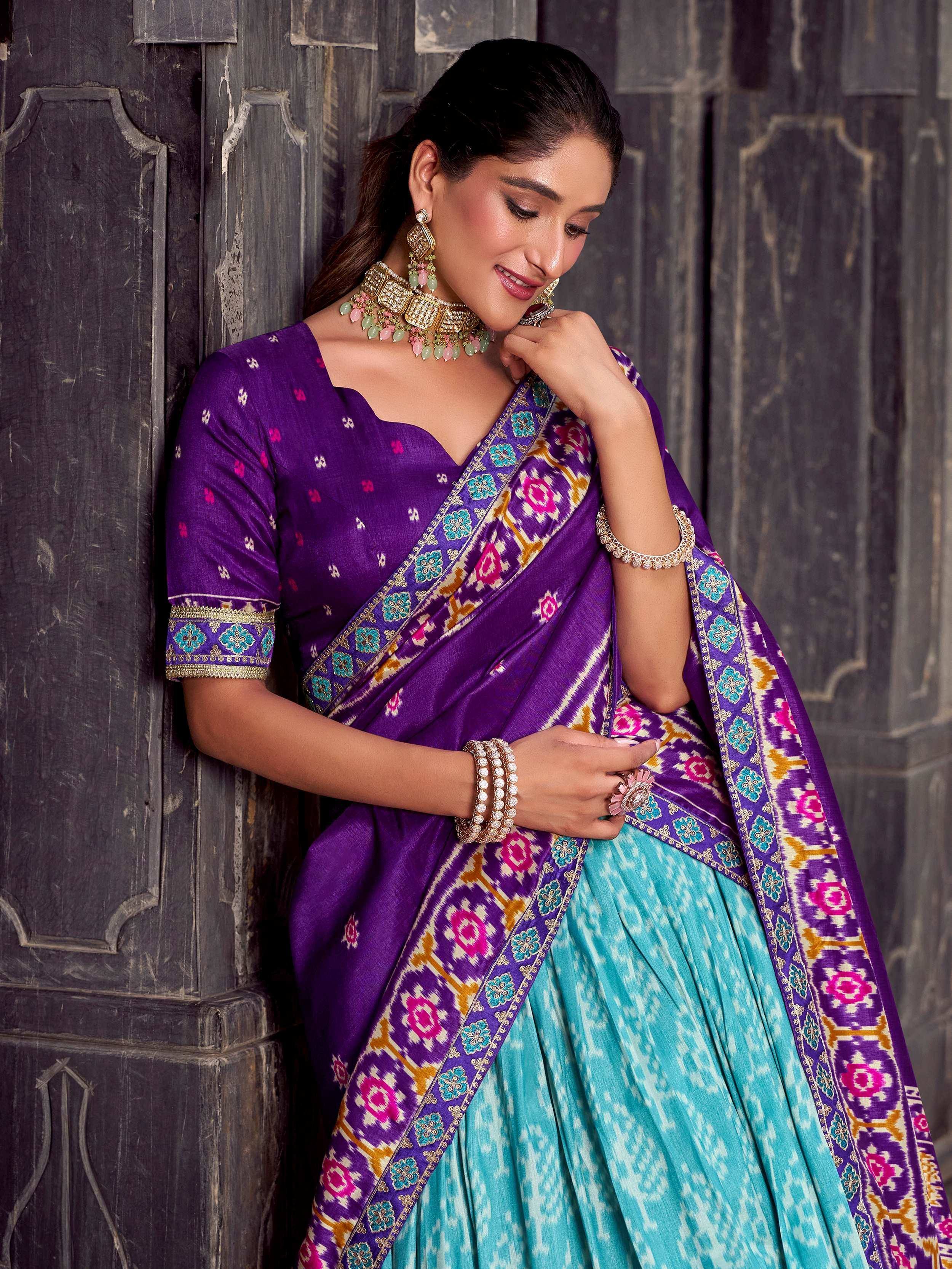 Purple and turquoise designer lehenga choli with floral ikat border, perfect for Indian ethnic wear