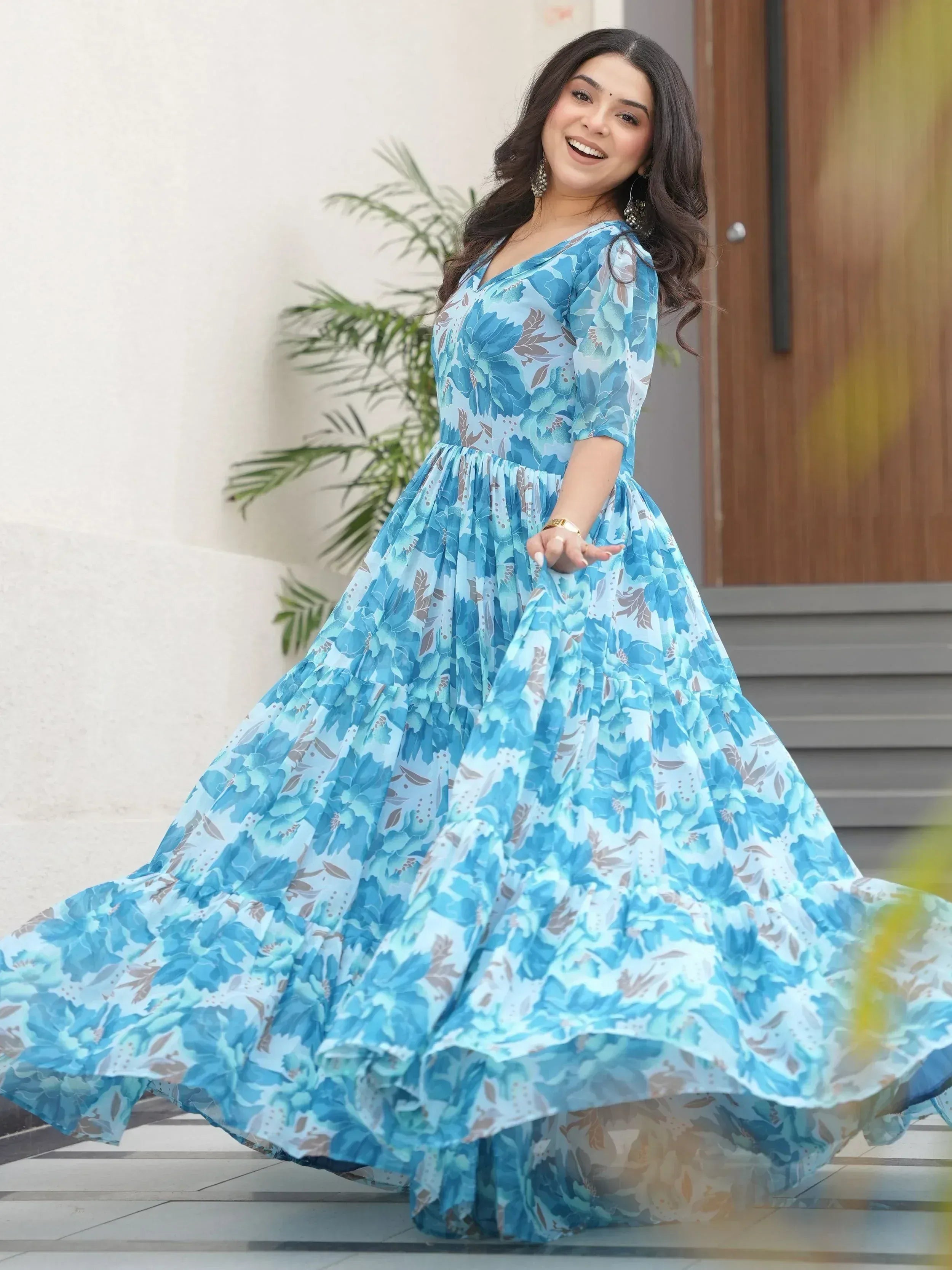 Blue floral ethnic gown with flared skirt, perfect for Indian occasions and festive wear.
