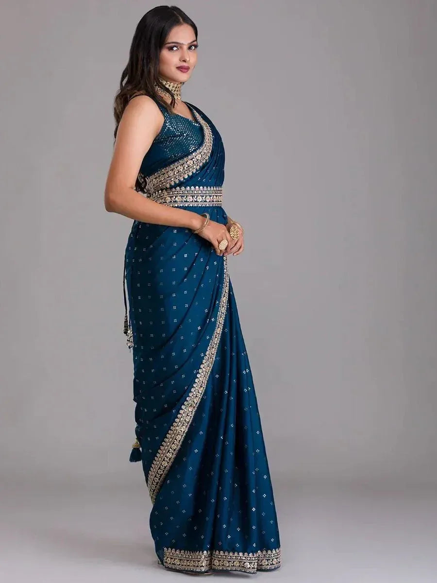 Teal blue designer saree with gold embroidery and sequin blouse, ethnic Indian wear for women
