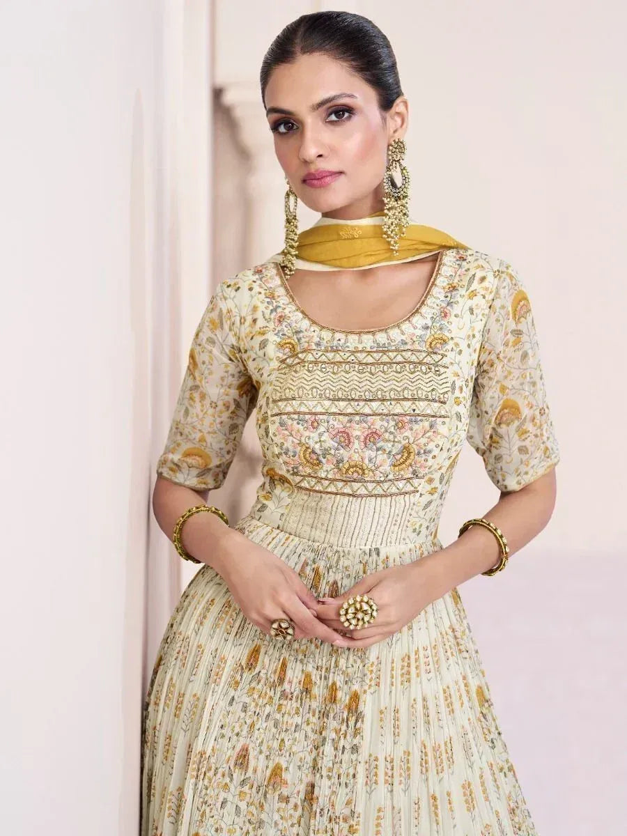 Floral printed ethnic gown with gold embroidery, perfect for Indian occasions and festive wear.