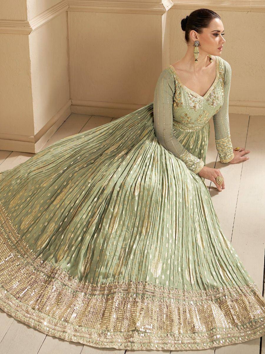 Elegant mint green designer lehenga choli with gold embroidery and pleated skirt for Indian ethnic wear