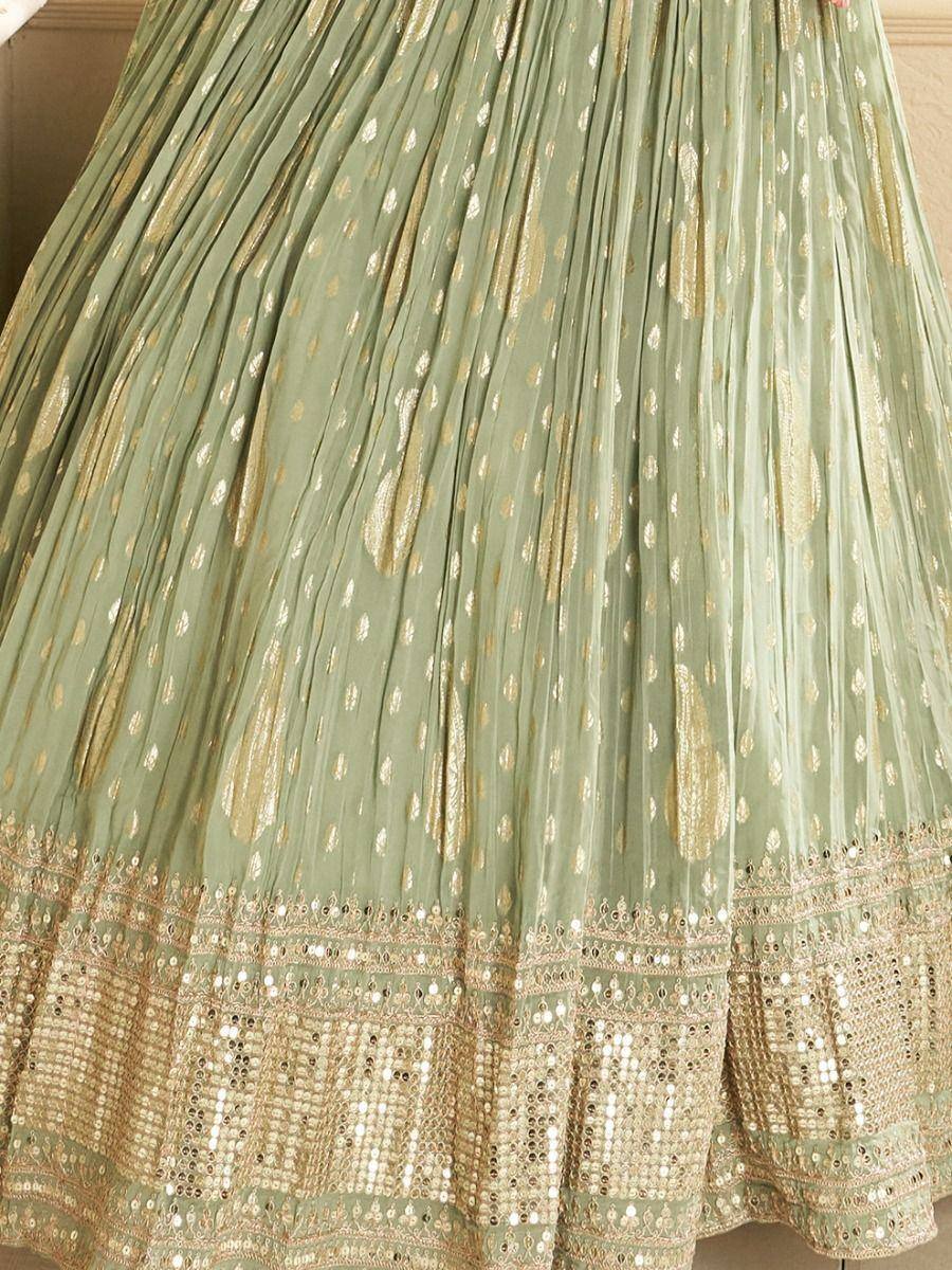 Mint green lehenga skirt with gold embroidery and sequin border, ethnic wear for festive occasions