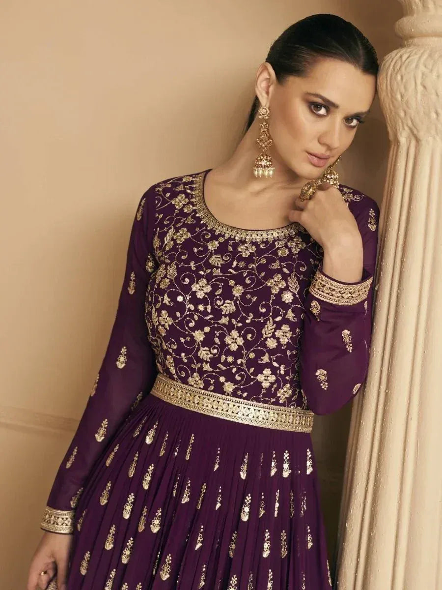 Purple ethnic gown with gold floral embroidery, perfect for Indian occasions and festive wear.