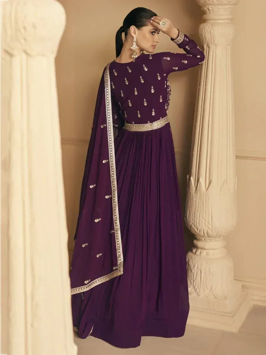 Purple ethnic anarkali gown with gold embroidery, perfect for Indian weddings and festive occasions.