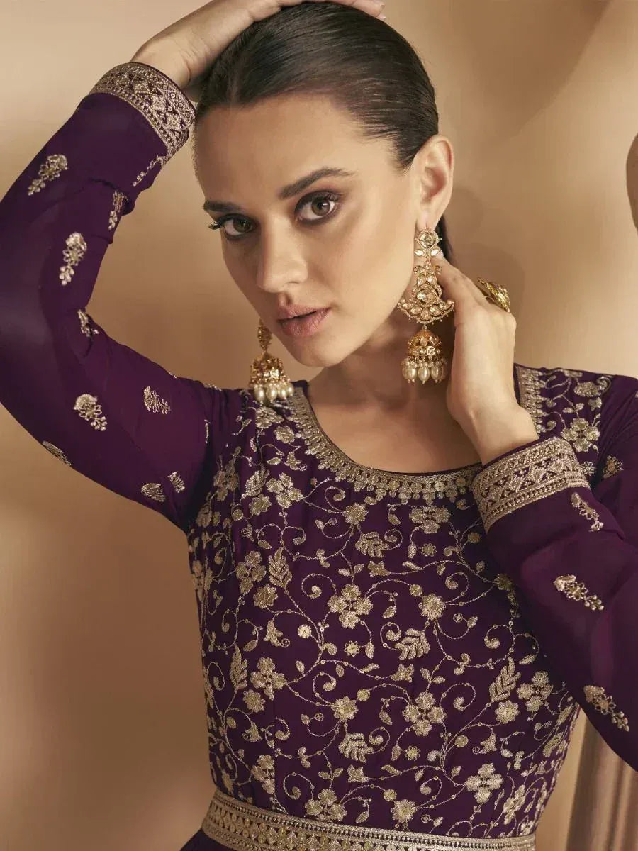 Purple ethnic gown with gold floral embroidery and matching jewelry for Indian wear